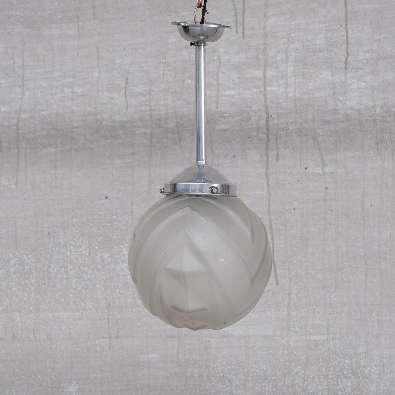 An etched glass pendant light raised on a fixed metal stem. 

The stem could be replaced by a hook so the light could go on a chain, which we can arrange upon request. 

France, c1930s. 

Unusual glass shade shape. 

Since re-wired and PAT