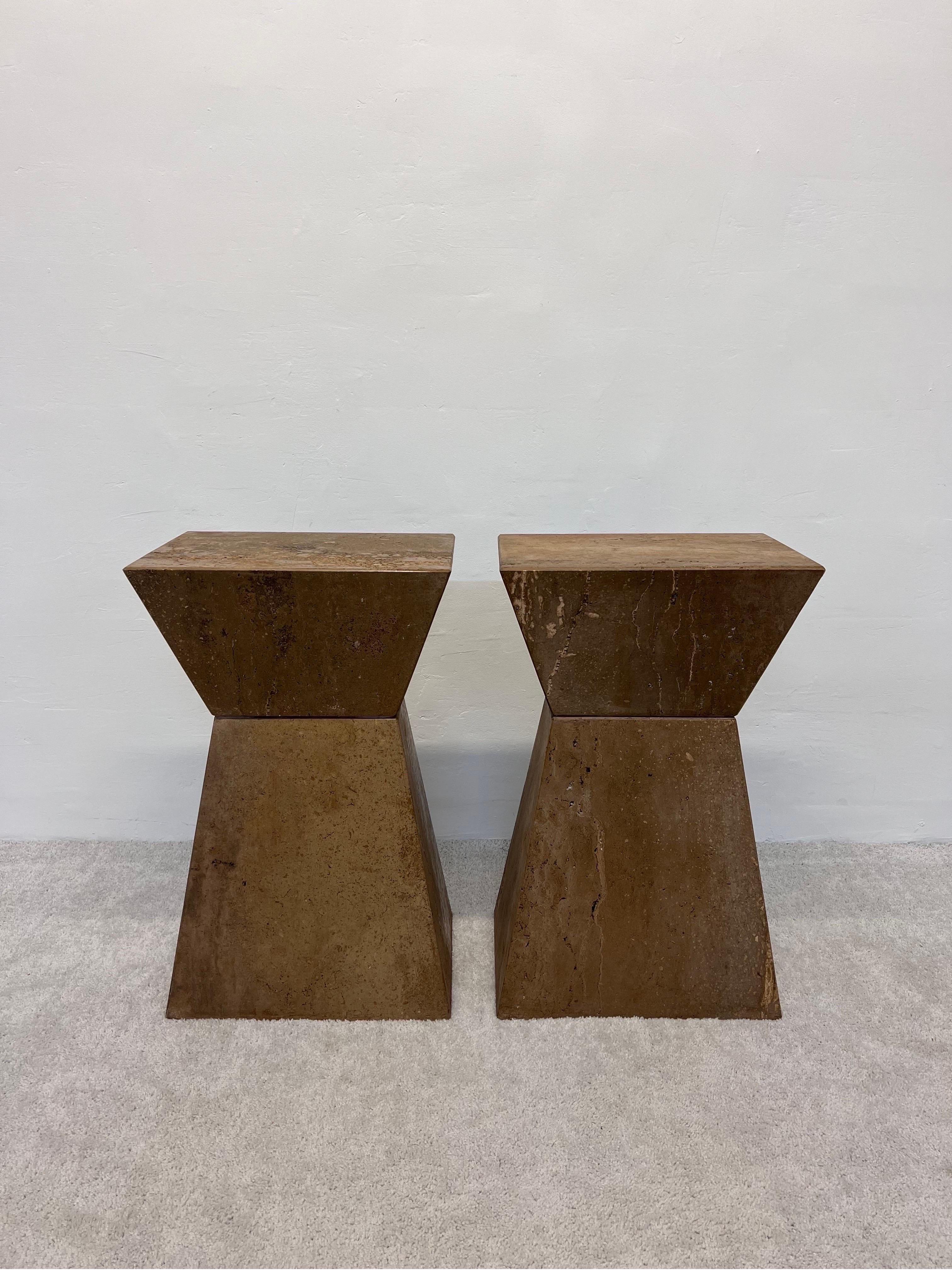 Pair of Italian travertine geometric pedestal tables, 1980s. These could also be used as bases for a dining or console table.