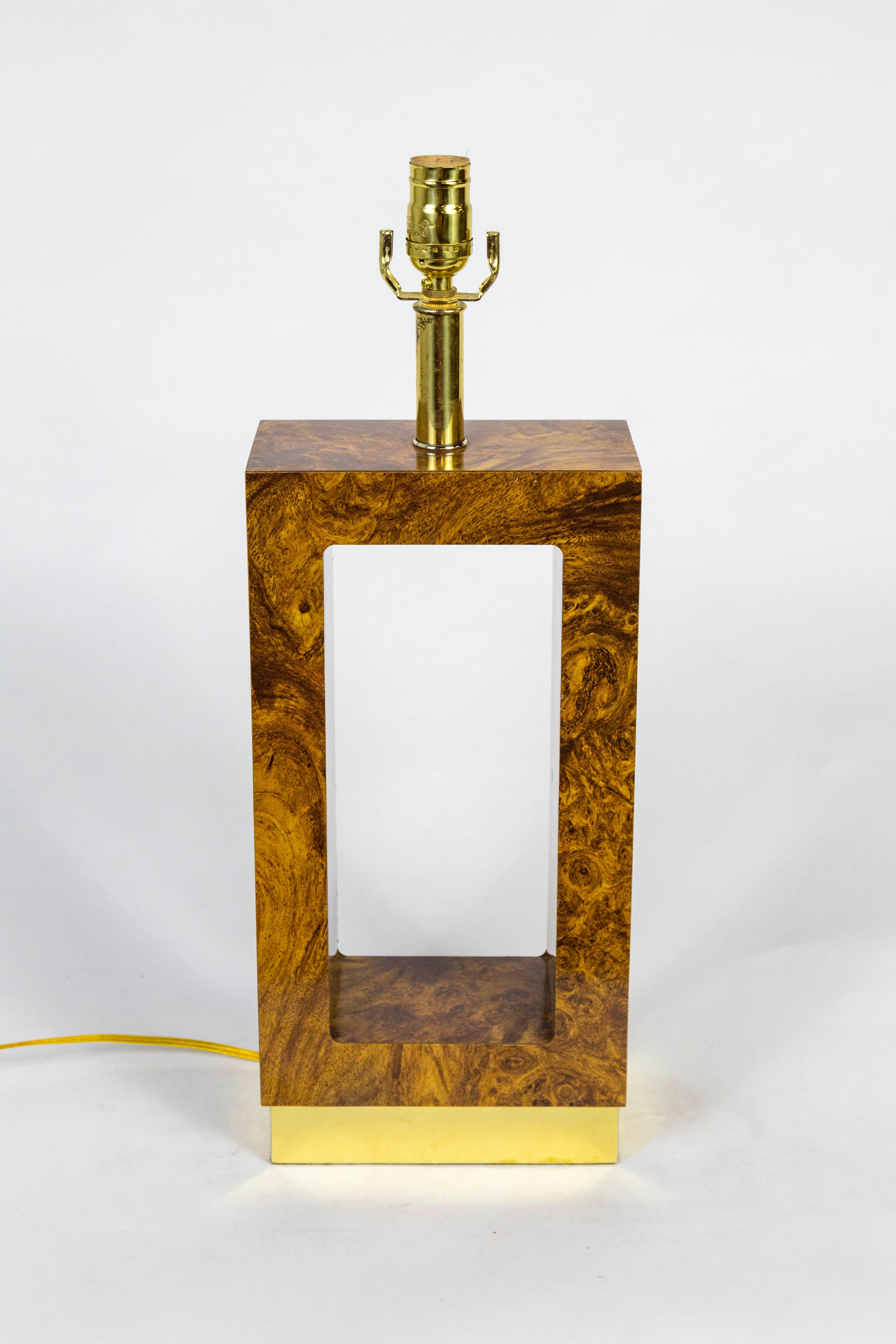 A 1970s chunky, open rectangular shaped table lamp in sleek finished faux bois formica and brass. Newly wired. 22