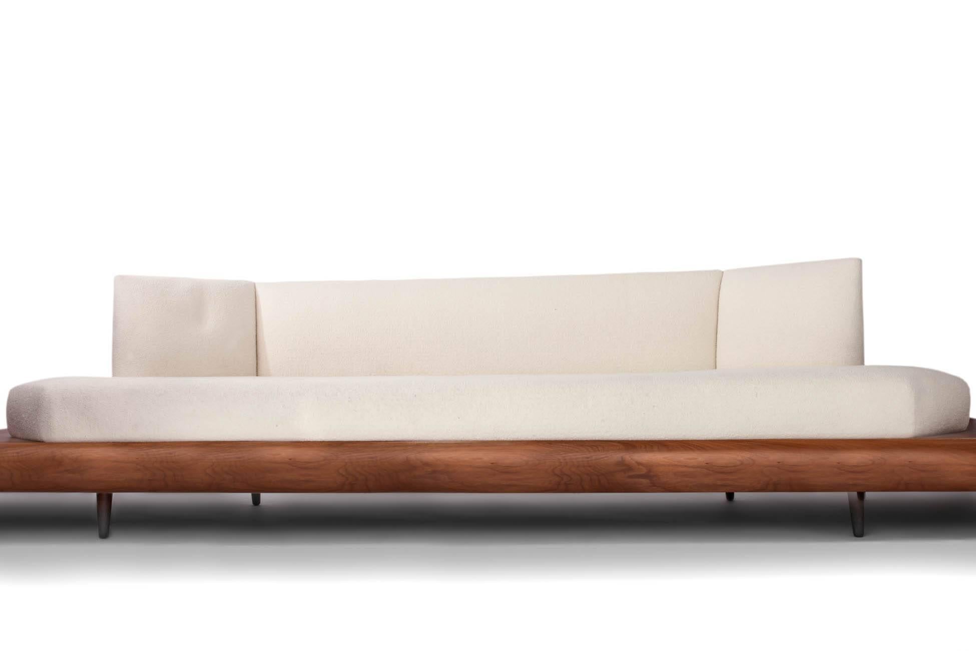 Adrian Pearsall (1925–2011)
An expressive and clean-lined floating geometric sofa by Adrian Pearsall for Craft Associates, with beautifully minimalist built-in end tables, in burled walnut with cream-colored Knoll upholstery.
A certificate of