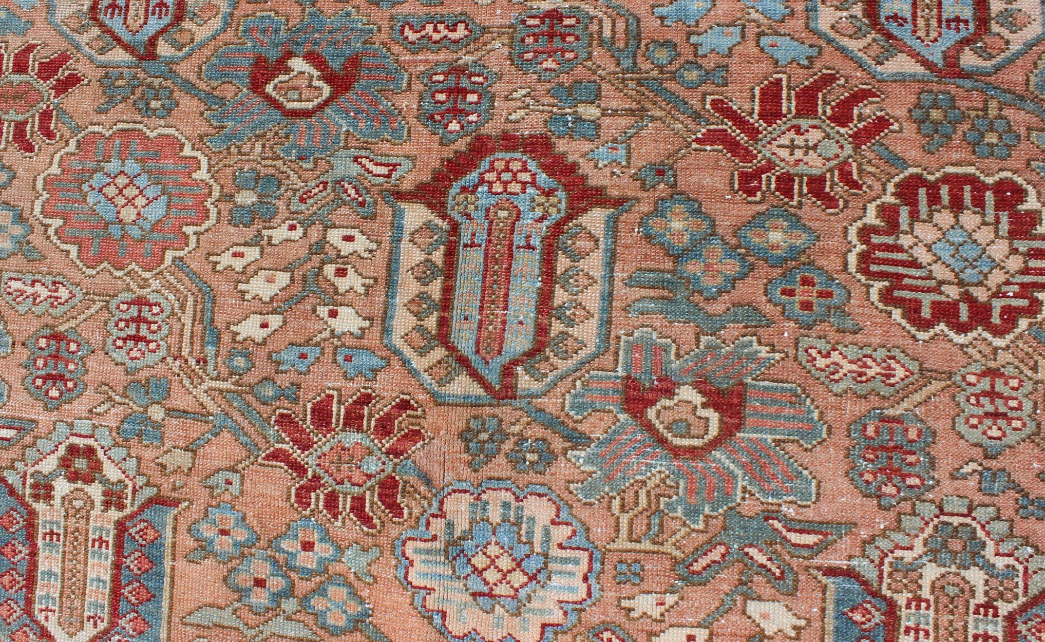 Early 20th Century Geometric-Floral Antique Persian Bakhtiari Rug with All-Over Design in Salmon For Sale