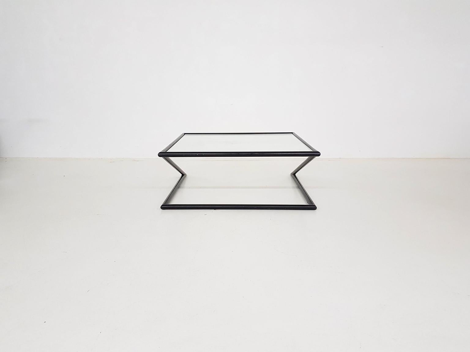 Stylish and geometric Z shaped coffee table by Dutch design firm Harvink from the 1980s.

Harvink is a Dutch high-end design furniture maker from the Netherlands most famous of their sofa designs. They also made other furniture such as this coffee