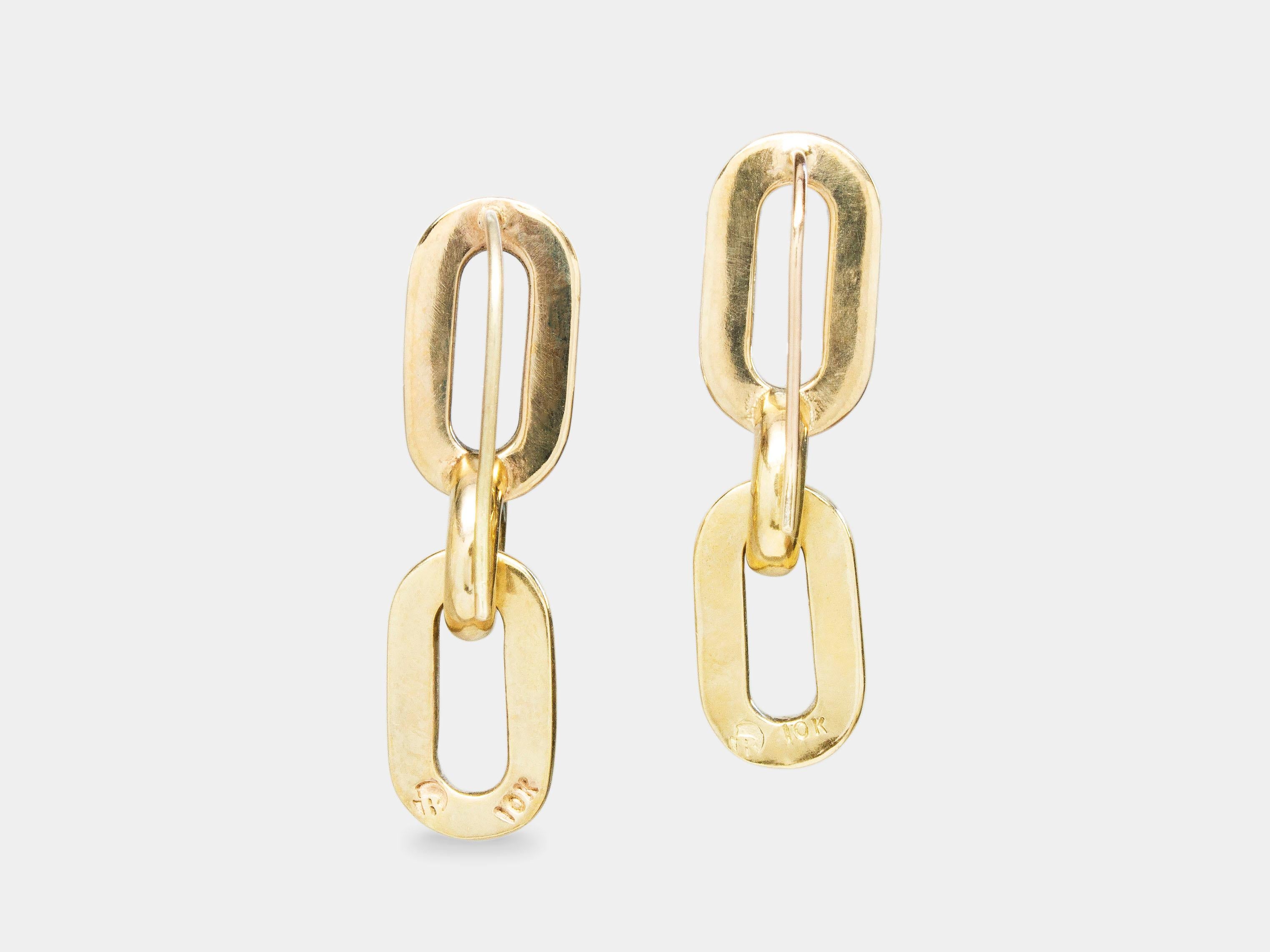 The Covalent Earrings from modern fine jewelry house, Baker & Black. More interesting than a basic but just as versatile, these classic drop earrings featuring geometric links compliment white tees and pantsuits in equal measure. 

• earrings