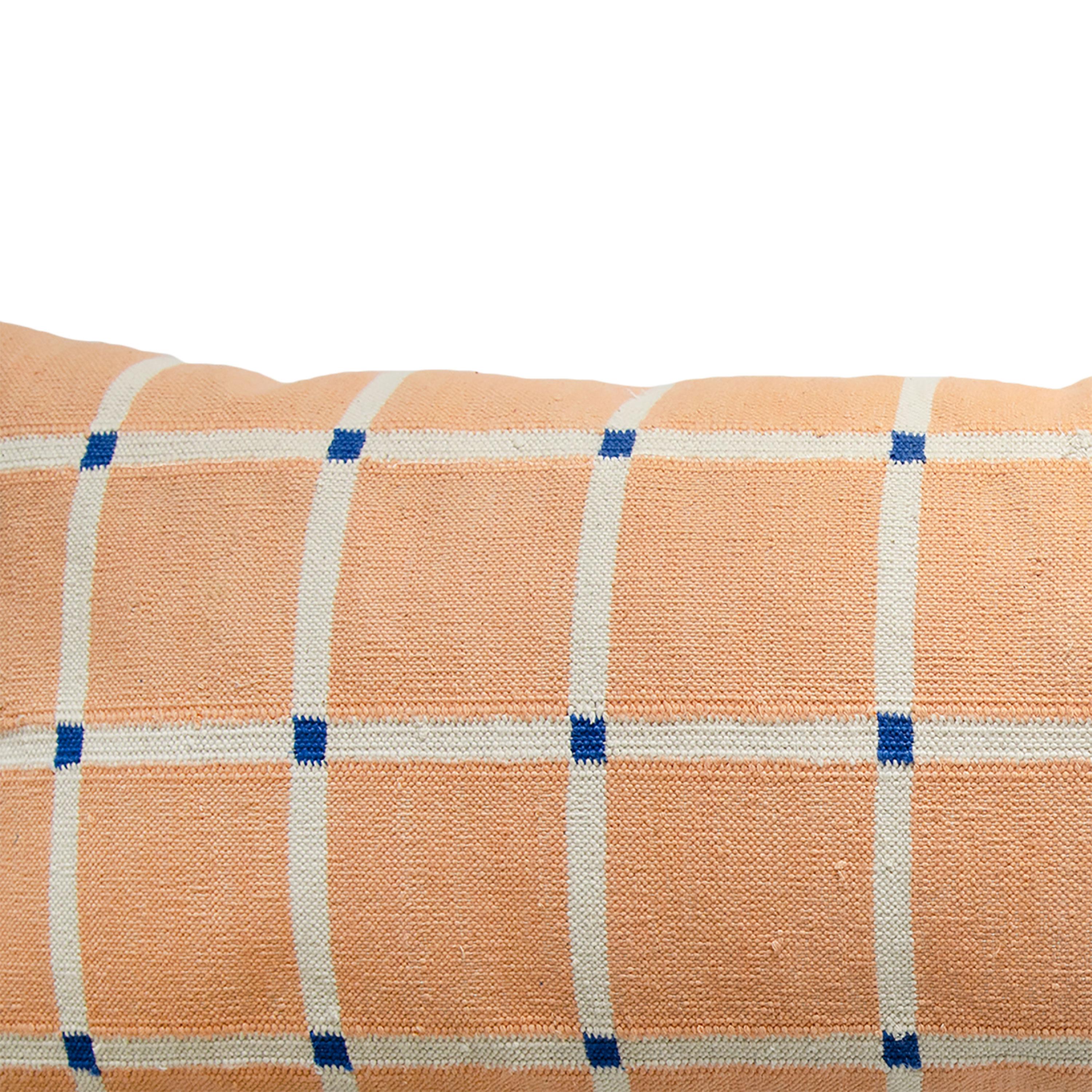 Our grid pillows are ethically hand woven by artisans in Rajasthan, India, using a traditional weaving technique which is native to this region.

The purchase of this handcrafted pillow helps to support the artisans and preserve their