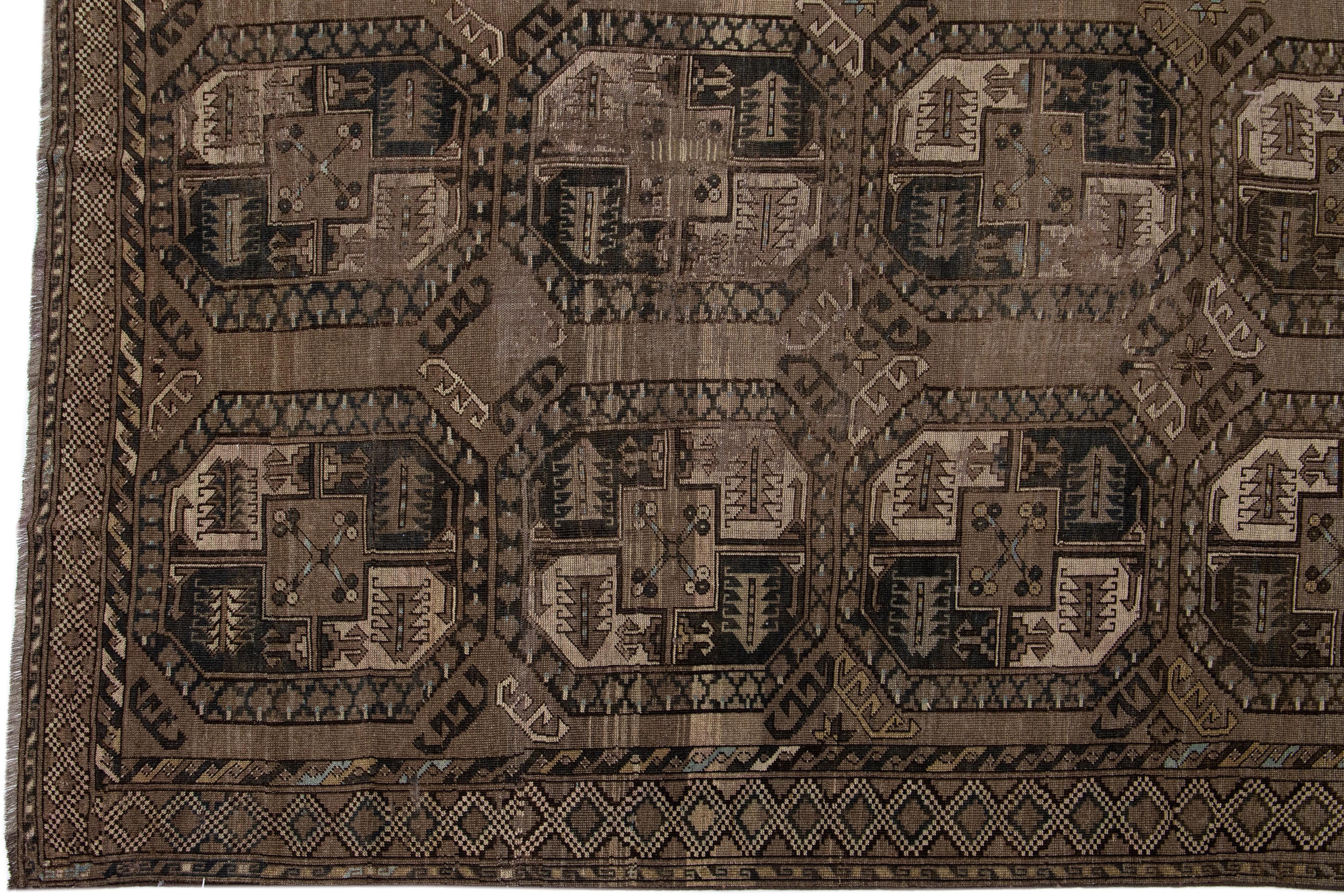 Islamic Geometric Handmade Antique Turkmen Persian Wool Rug with Brown Field For Sale