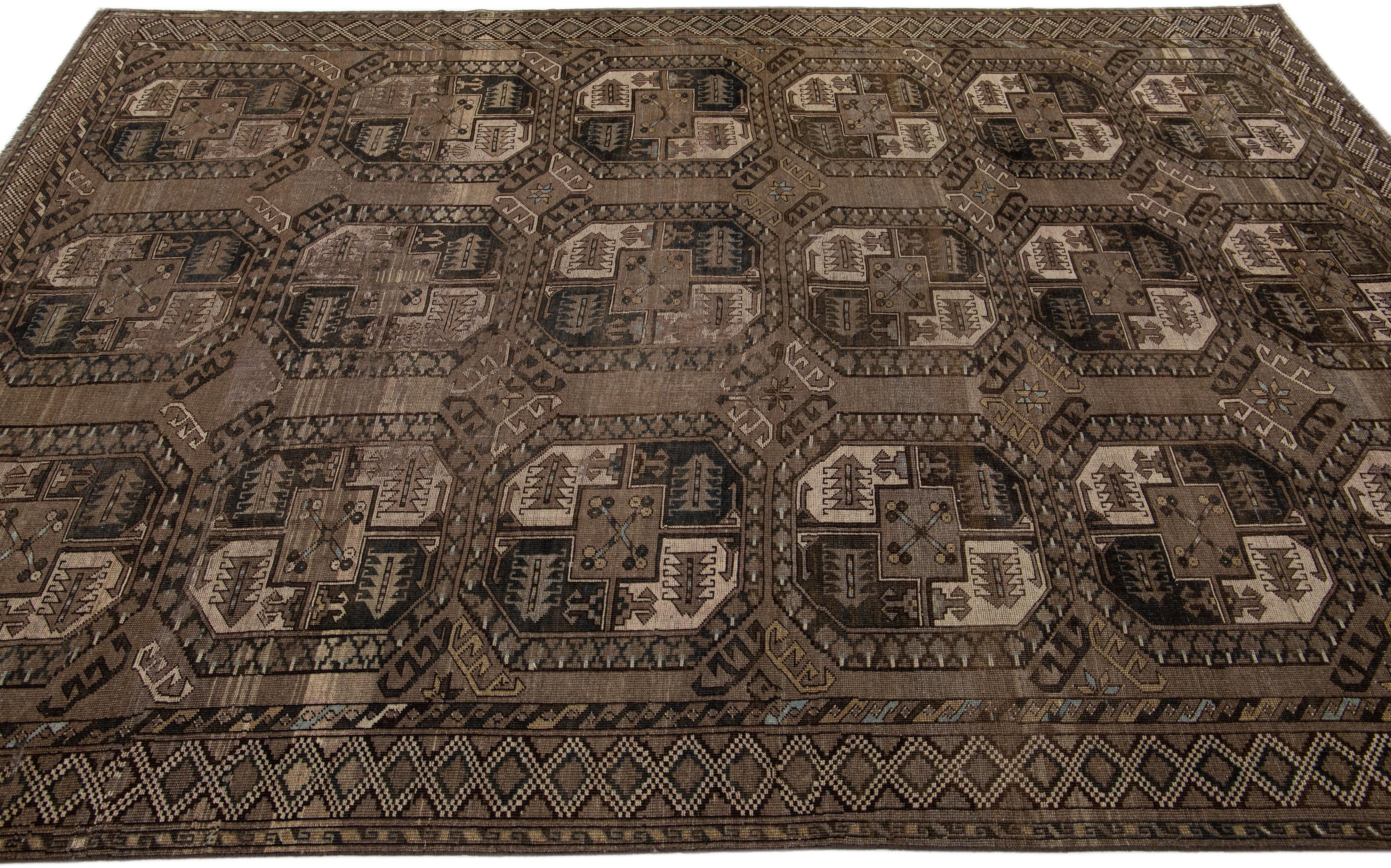 Geometric Handmade Antique Turkmen Persian Wool Rug with Brown Field In Excellent Condition For Sale In Norwalk, CT