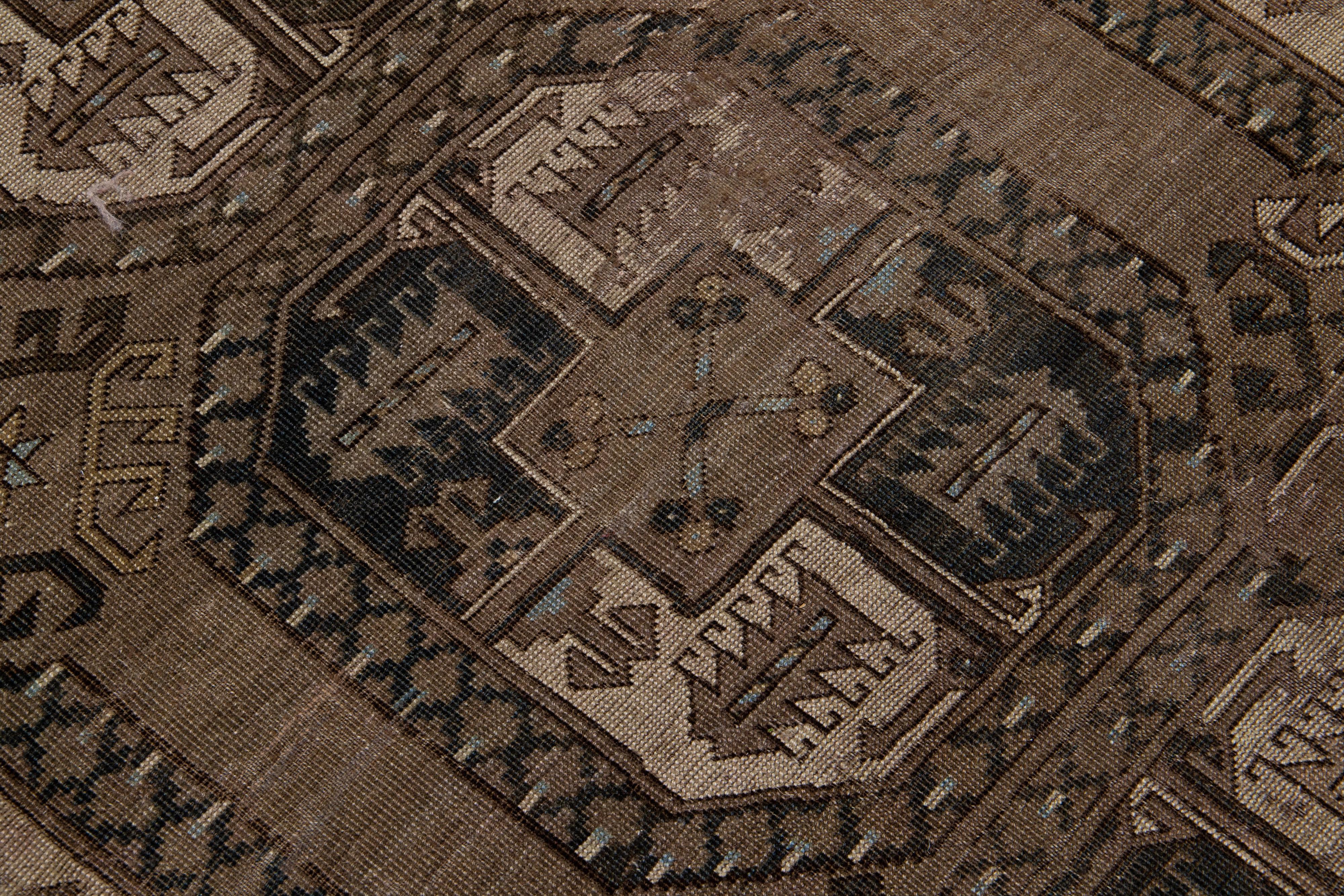 20th Century Geometric Handmade Antique Turkmen Persian Wool Rug with Brown Field For Sale