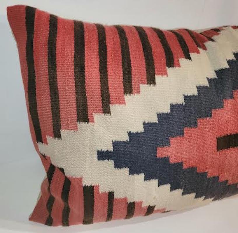 Large Geometric Indian weaving bolster pillow with cross. Feather and down insert. Zippered case.