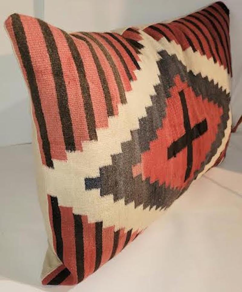 Large geometric Indian weaving pillow with stripes and cross. Feather and down insert. Zippered case.