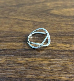 Geometric Infinity Twist Brilliant Cut White Diamond 18 Karat White Gold Ring