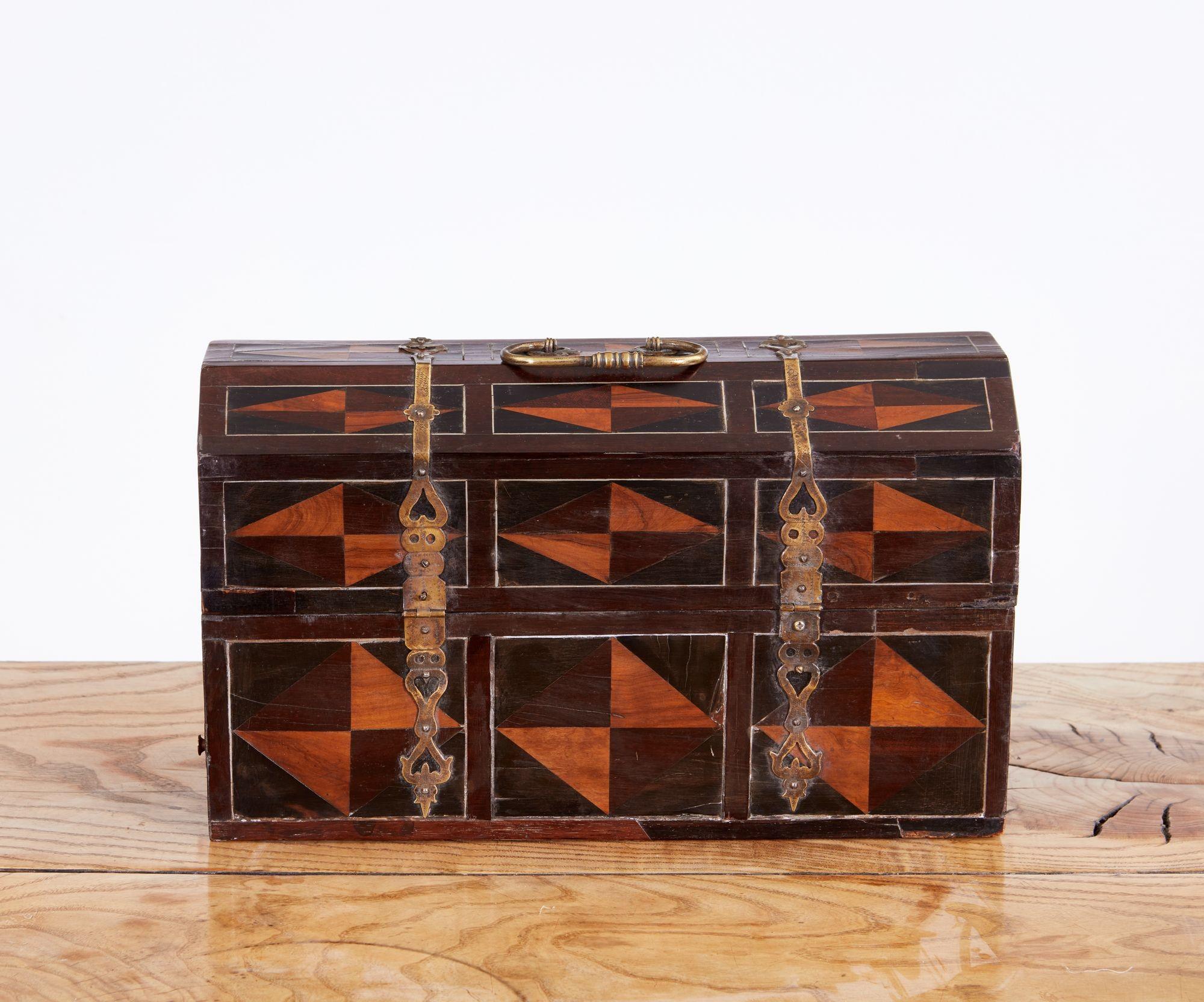 Fine 17th century geometric marquetry inlaid rosewood casket with strapwork hinges, pewter string inlay around ebony and fruitwood panels, the lower portion with long drawer on side, Antwerp circa 1700.