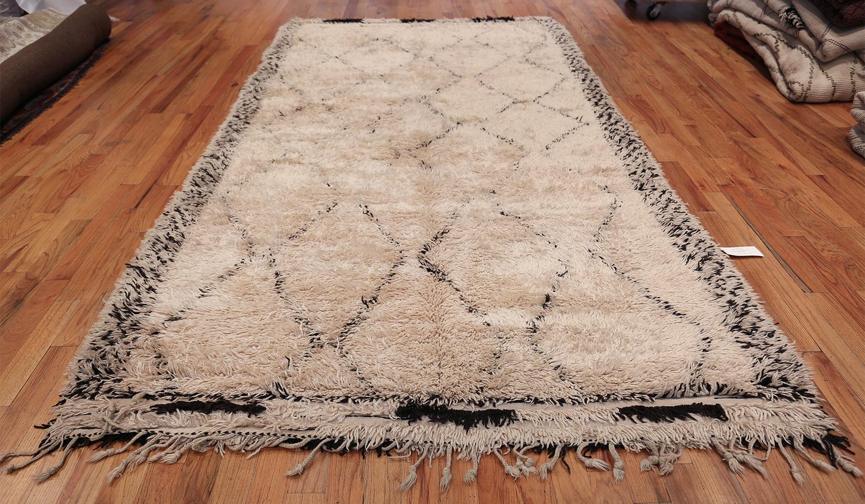 Breathtaking Diamond Geometric Vintage Ivory Shag Moroccan Beni Ourain Rug, Country of Origin / Rug Type: Morocco, Circa Date: Mid – 20th Century. Size: 6 ft 3 in x 12 ft 2 in (1.9 m x 3.71 m)

Moroccan Beni Ourain rugs hold a special place in