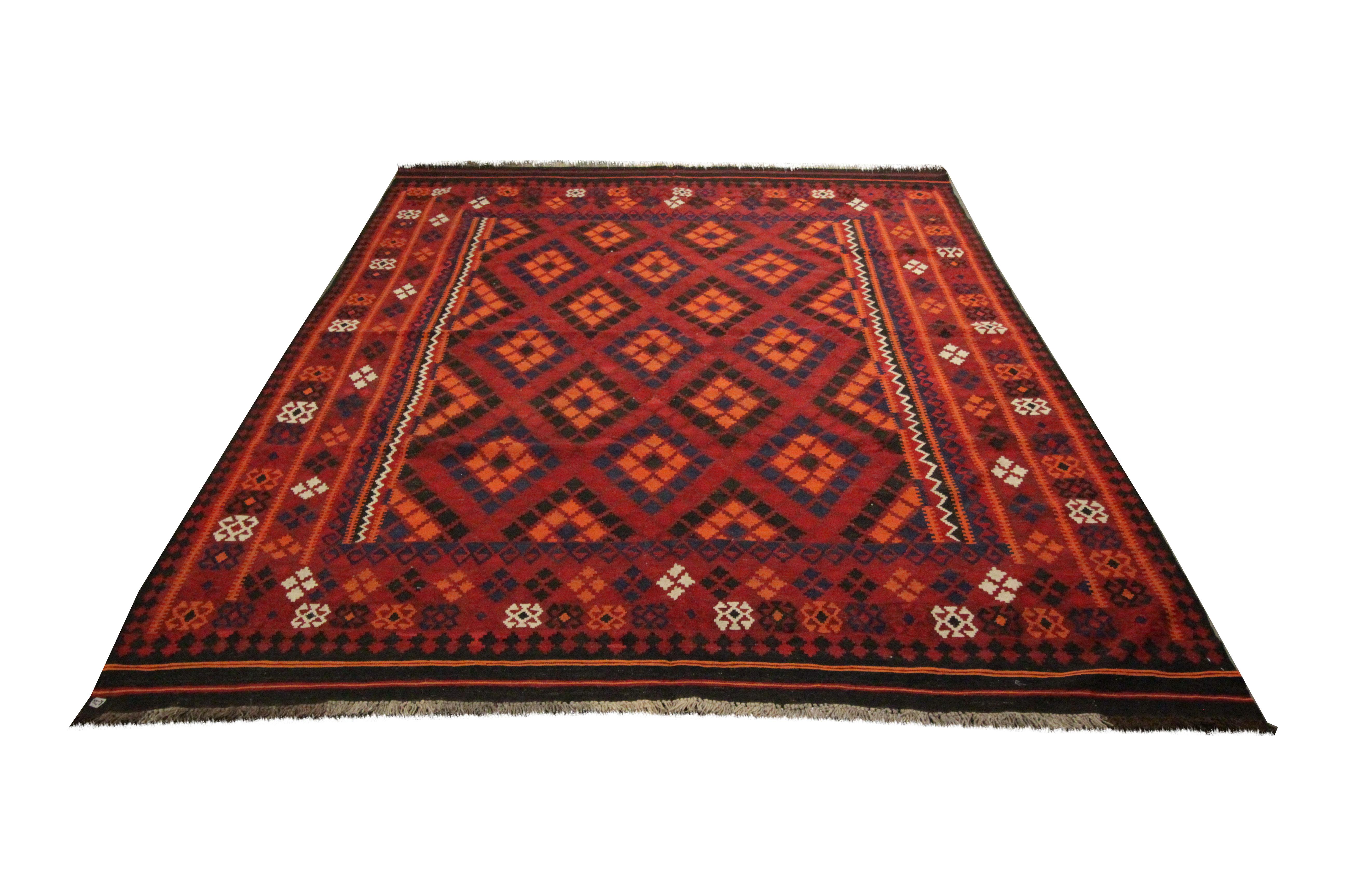 A bold geometric design has been woven in this fine wool kilim rug. It features a bold colour palette with accents of red, orange and blue. The design, pattern and colours in this piece make it sure to uplift any home interior. Easily style this