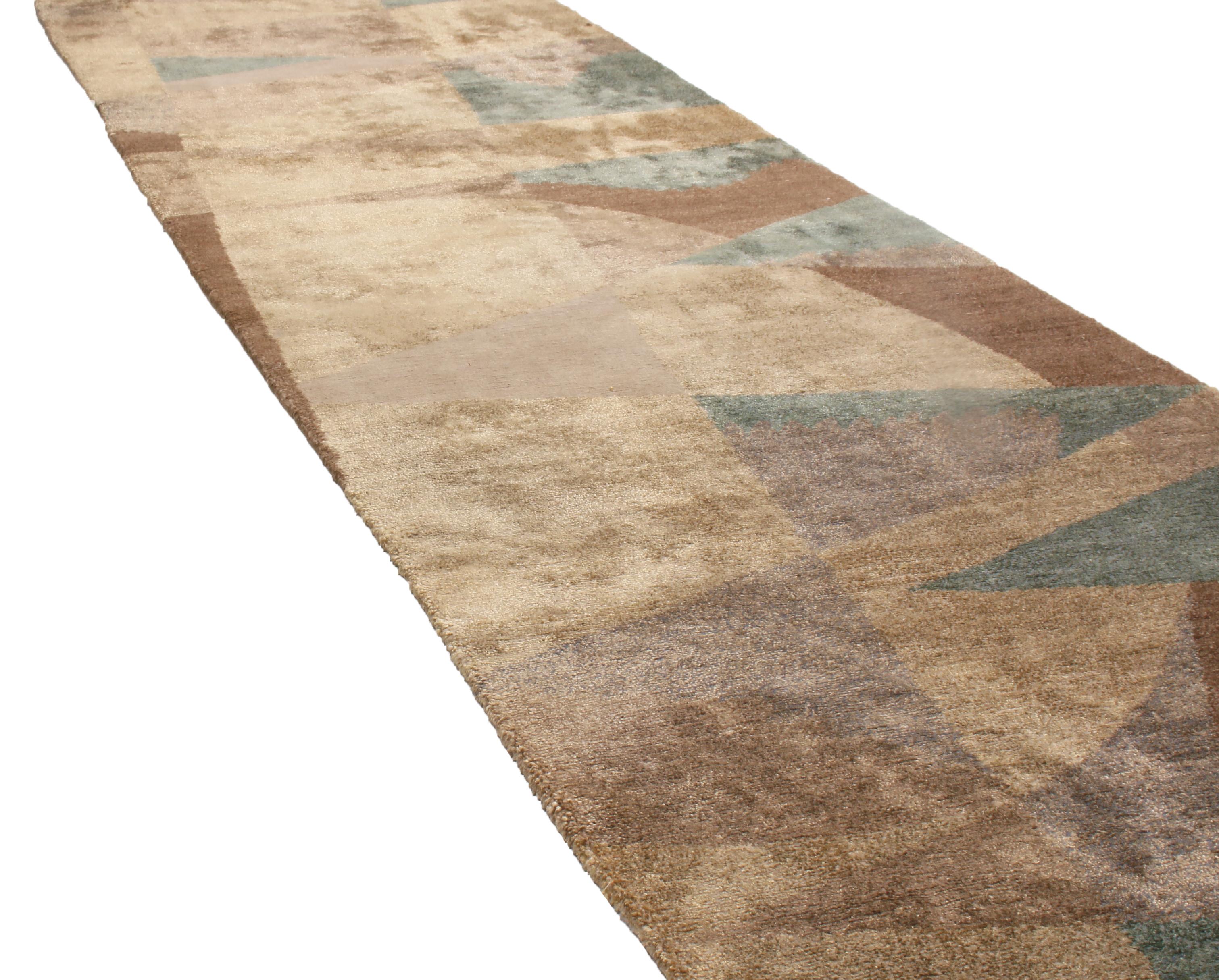 Hand-knotted in Nepal with high-quality wool and silk, this runner hosts a unique geometric 