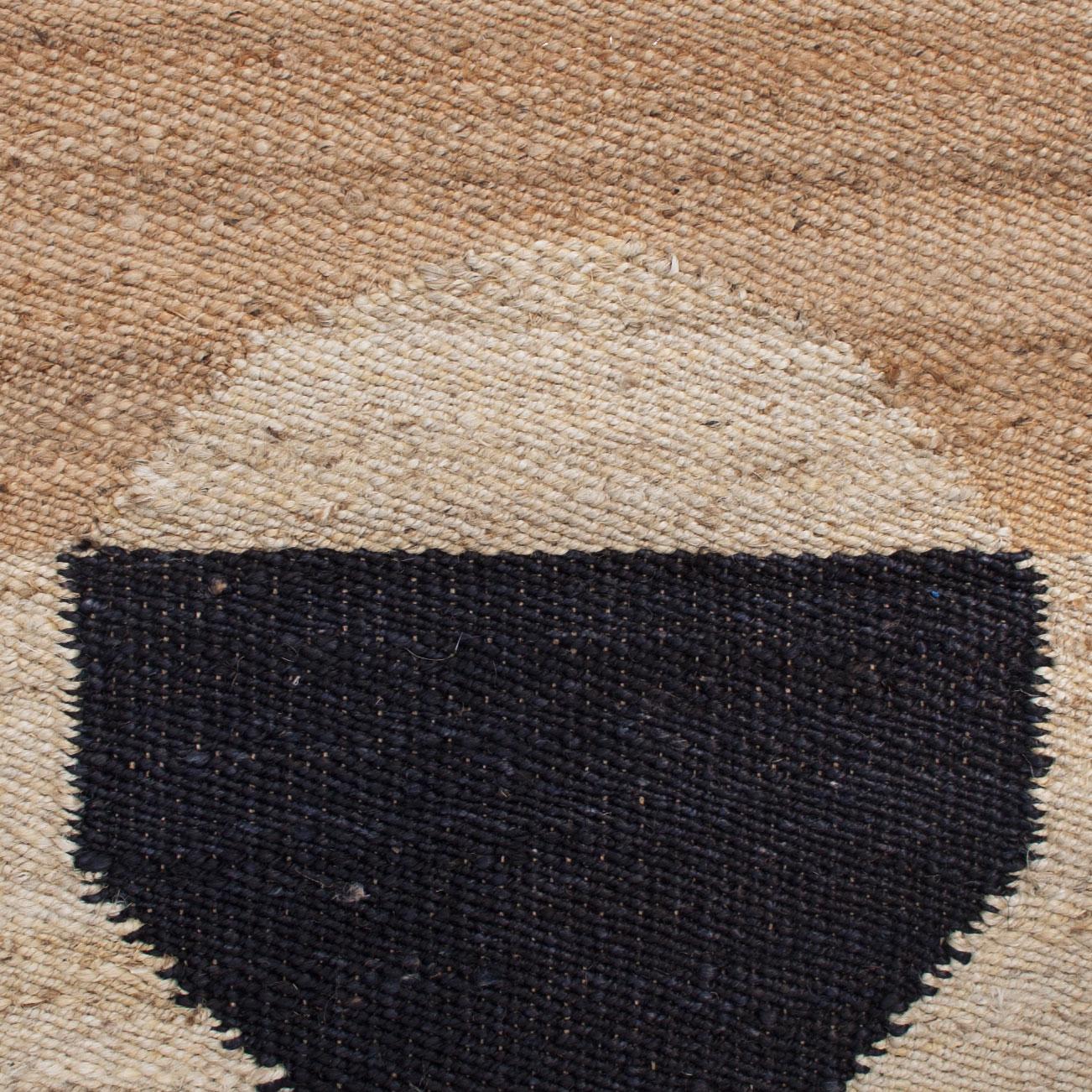 This modern area rug has been ethically handwoven in the finest jute yarns by artisans in Rajasthan, India, using a traditional weaving technique which is native to this region.

The purchase of this handcrafted rug helps to support the artisans