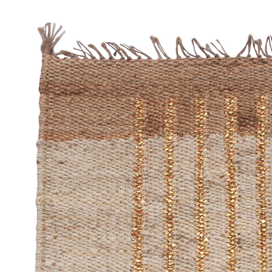 This modern area rug has been ethically hand woven in the finest jute yarns by artisans in Rajasthan, India, using a traditional weaving technique which is native to this region.

The purchase of this handcrafted rug helps to support the artisans