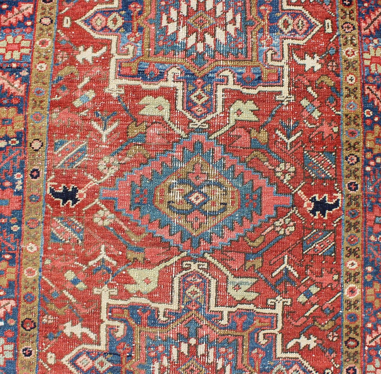 Early 20th Century Geometric Medallion Antique Persian Heriz Runner in Brick Red and Blue For Sale