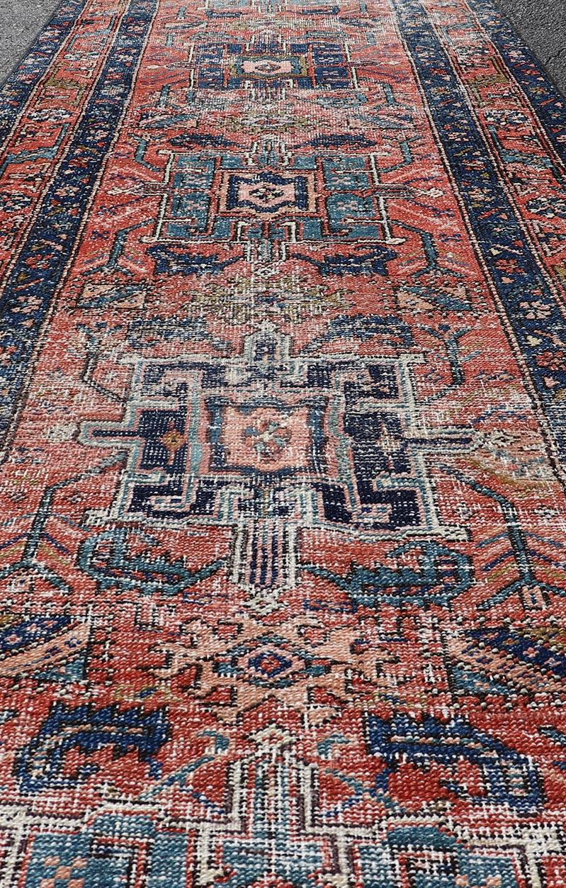 Geometric Medallion Antique Persian Heriz Runner in Orange-Red and Blue. Keivan Woven Arts / rug EMB-22117-15011, country of origin / type: Iran / Heriz, circa 1920
Measures: 3'0 x 10'7 
This antique Persian Heriz runner, from northwest Iran,