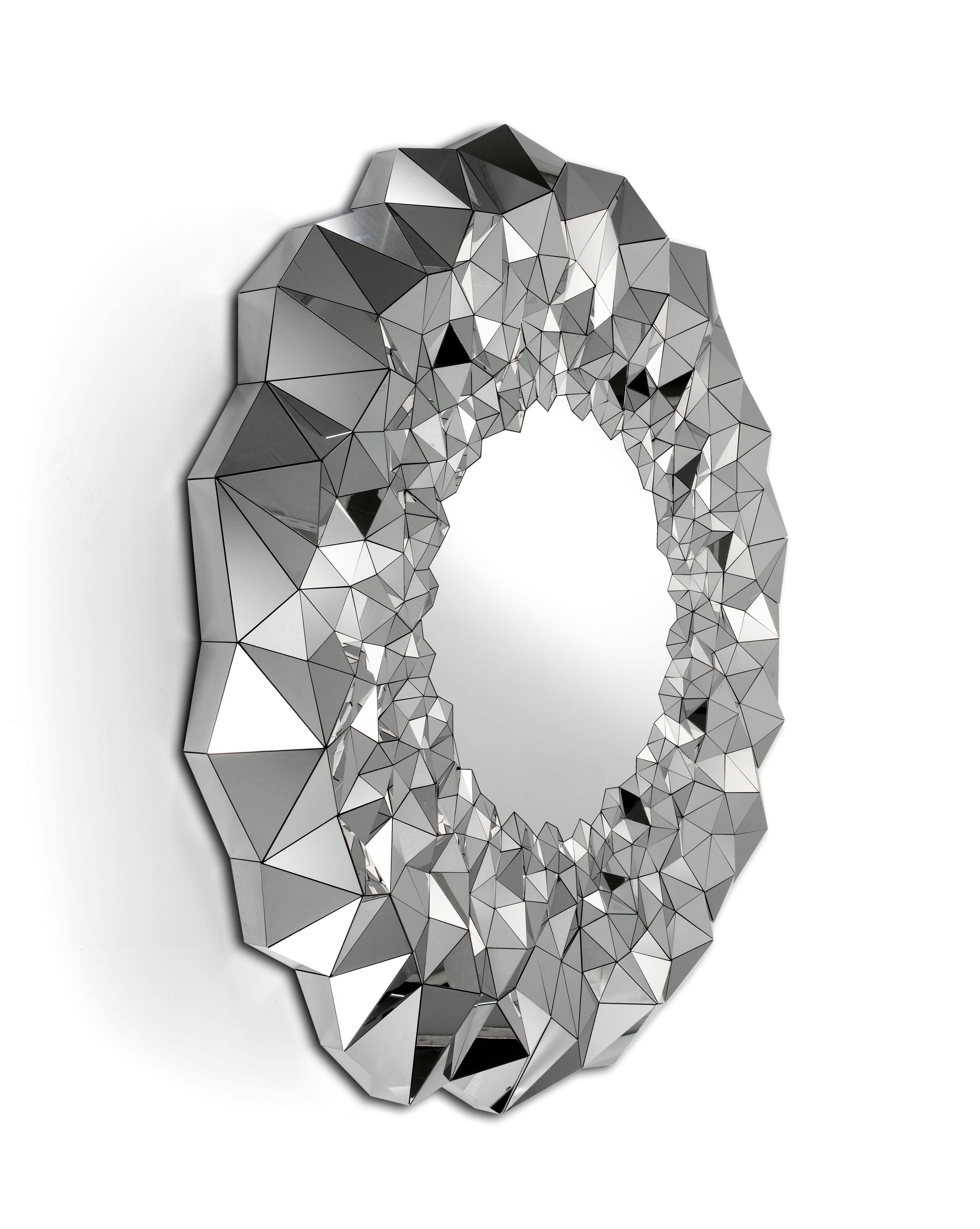 Part of the award winning stellar collection - the stellar mirror is inspired by the precious qualities of naturally forming amethyst geodes and machine cut diamonds. The large expansive center of the mirror is in stark contrast to the turbulent