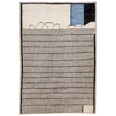 Tapis en laine géométrique et moderne de style marocain, fait à la main en beige