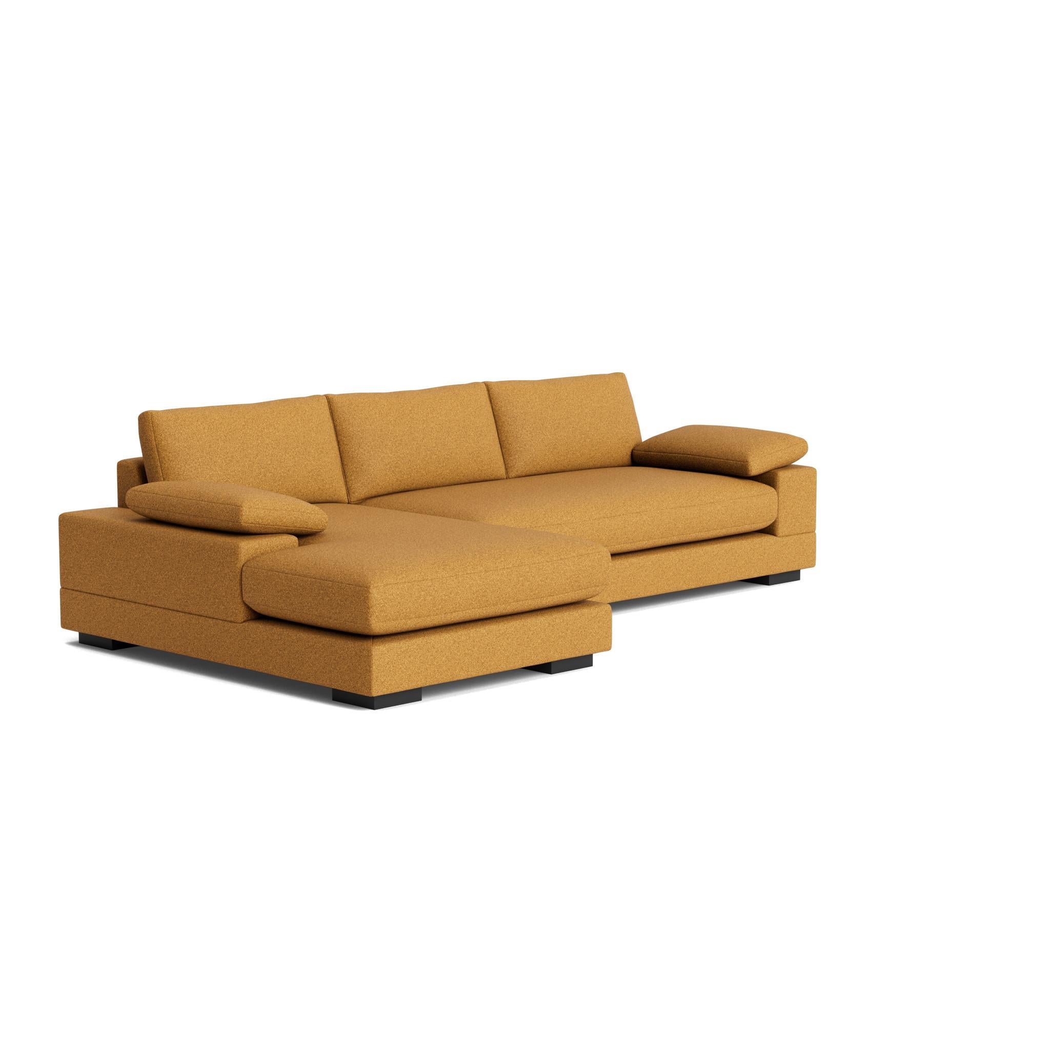 The Geometric Modern Sofa exudes understated elegance. Its extra-wide, rectilinear arms are adorned with relaxed throw pillows, all resting on a single, seamless bench seat—chic and effortlessly comfortable.