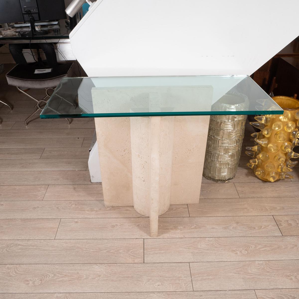 Geometric motif travertine console table with glass top.