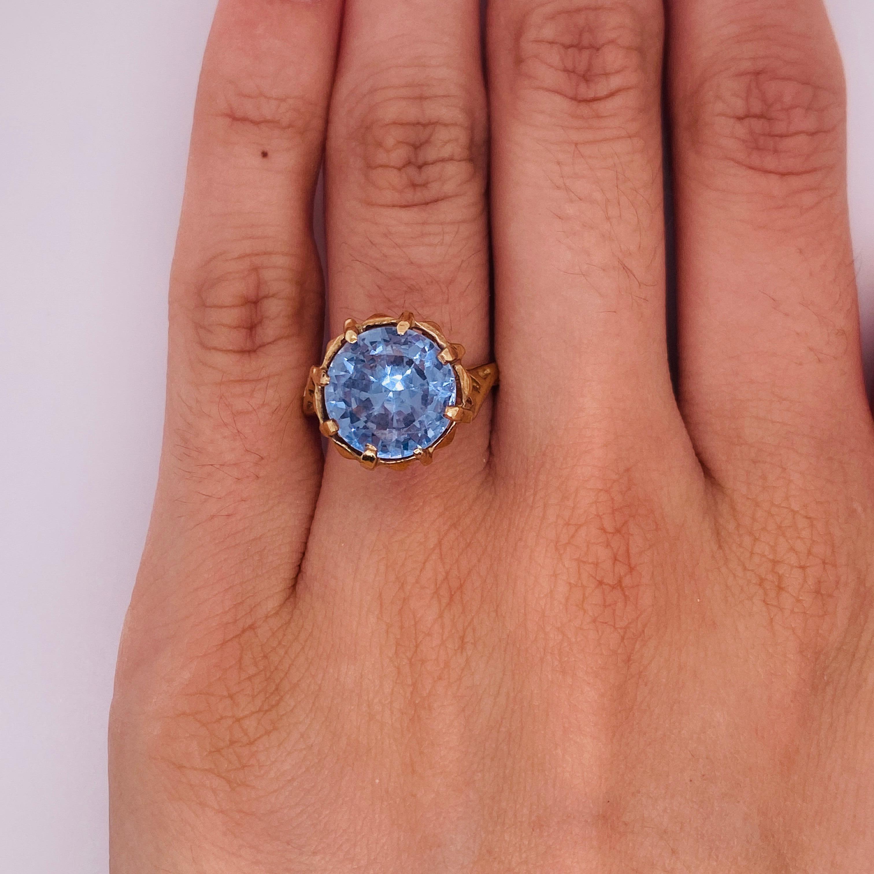 This vintage ring is an architectural stunner! The 6.25 carat blue zircon mesmerizes with sparkles and depth. Iconic geometric shapes are everywhere in this vintage winner!  From an angle, the ring structure comes alive! Spiral cathedral styling