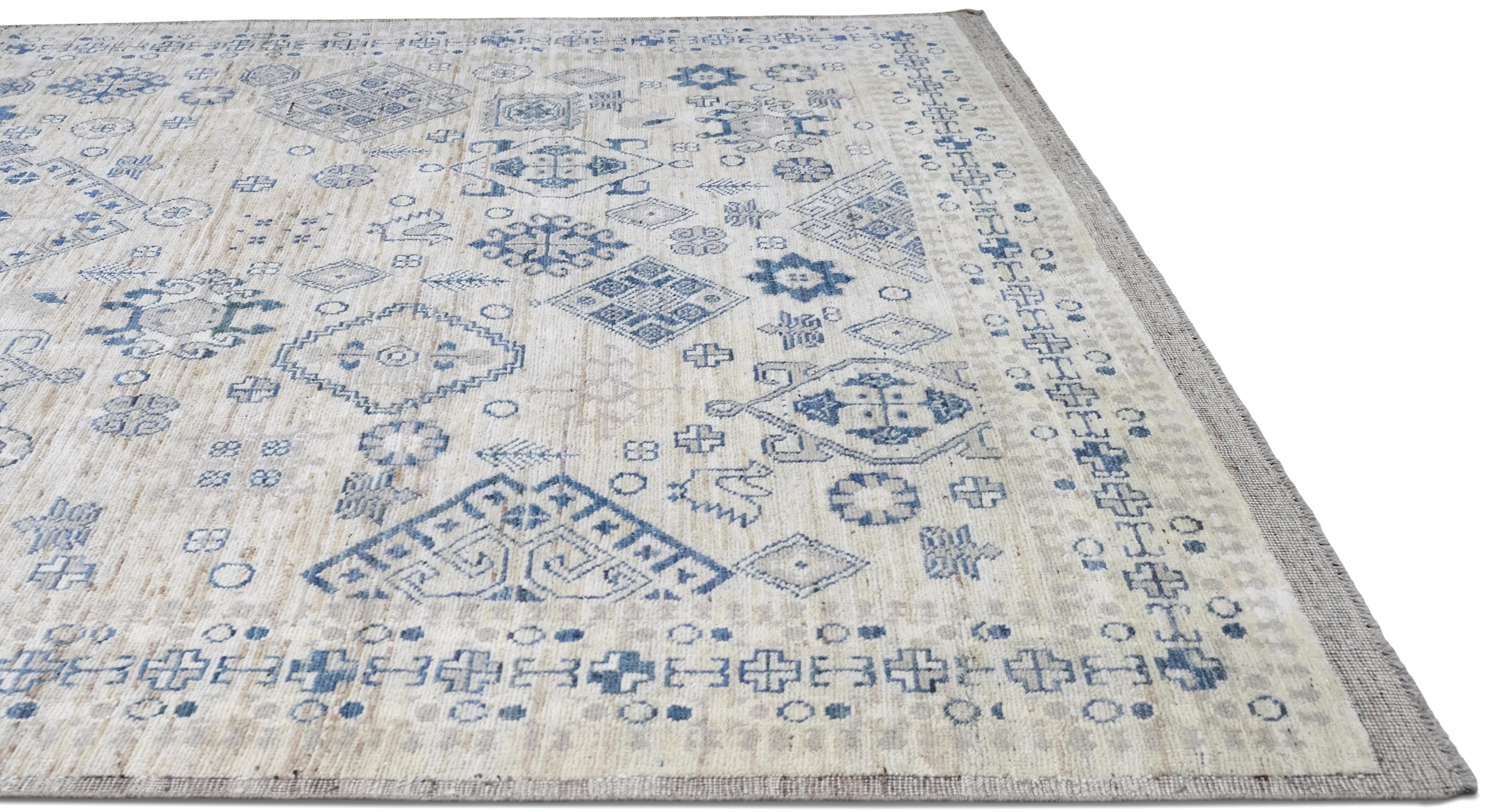 This beautiful hand-knotted wool Oushak rug is a testament to exceptional craftsmanship and timeless design. Measuring approximately 7'10