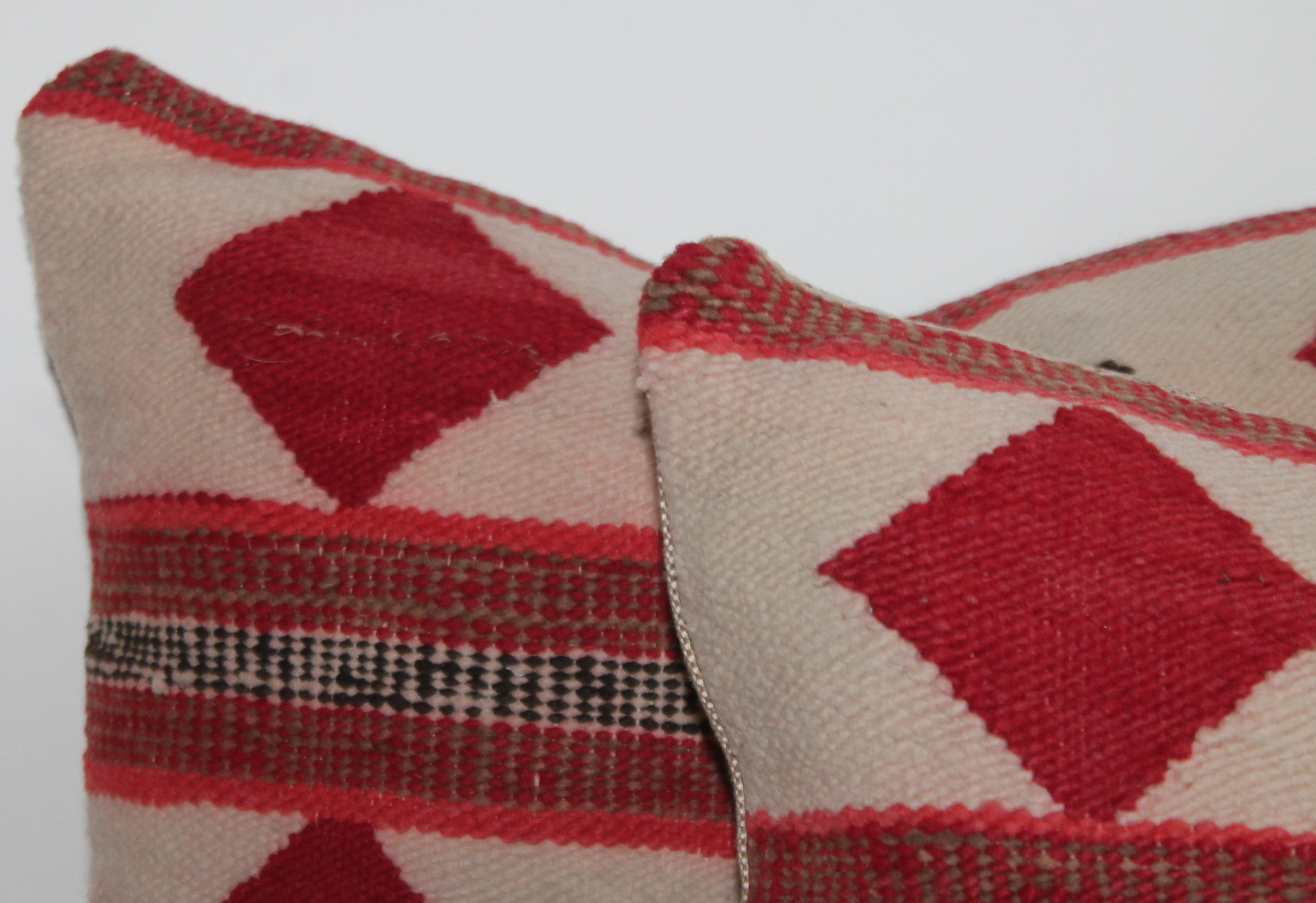 Geometric pair of Navajo Indian pillows with diamond and stripe design.