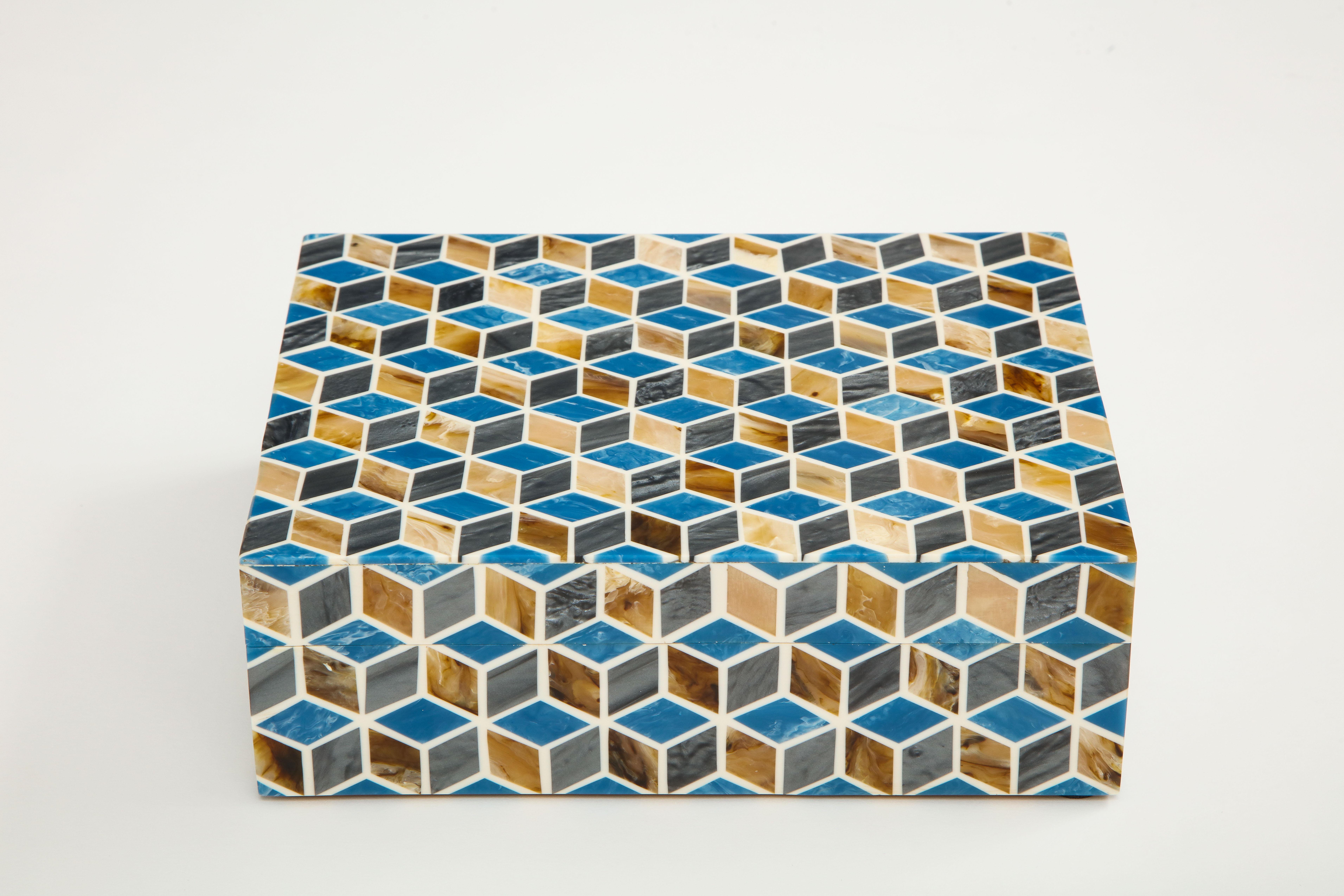 Geometric patterned box featuring dyed blue, natural horn inlay pieces, lined in wood.