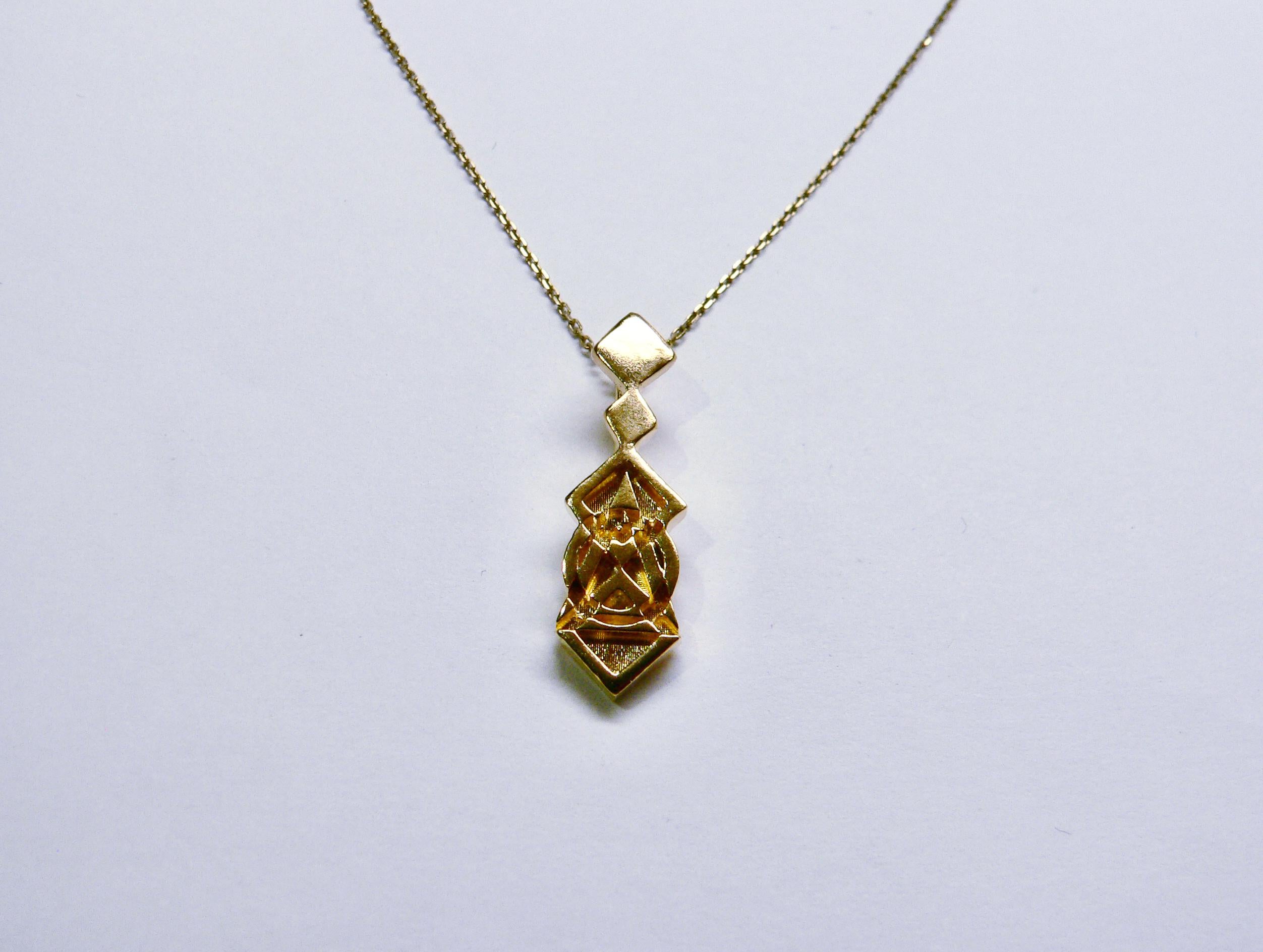 There are some geometric shapes. This item has combined with some geometric shapes. Pattern A and B are a kind of inside out pattern. This pendant is made of Sterling Silver with 18 karat yellow gold plated as one of the Geometry Collection. 

This