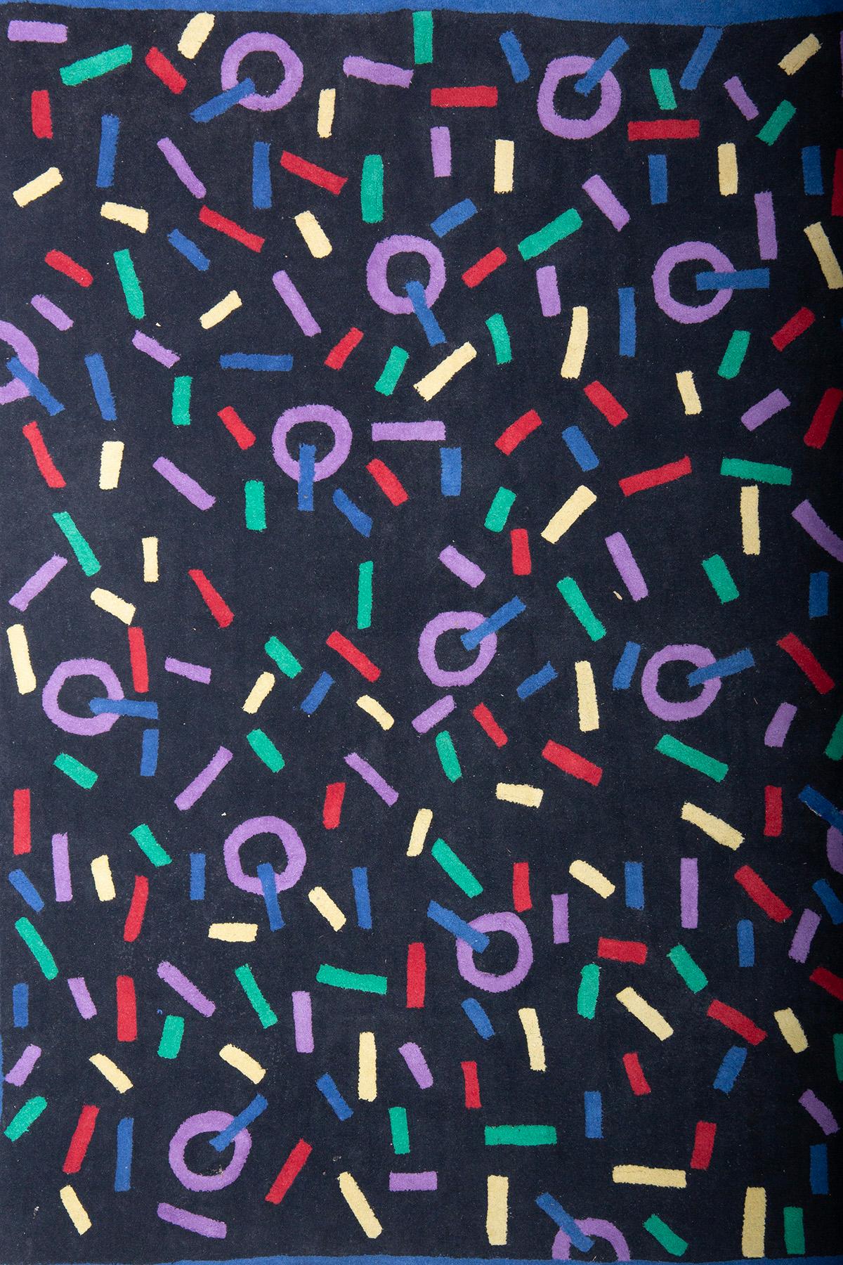 Step into the vibrant era of the 1970s and 80s with this exquisite vintage rug. This piece embodies the bold and innovative design aesthetics of its time, making it a standout addition to any home or collection. The rug features a striking pattern