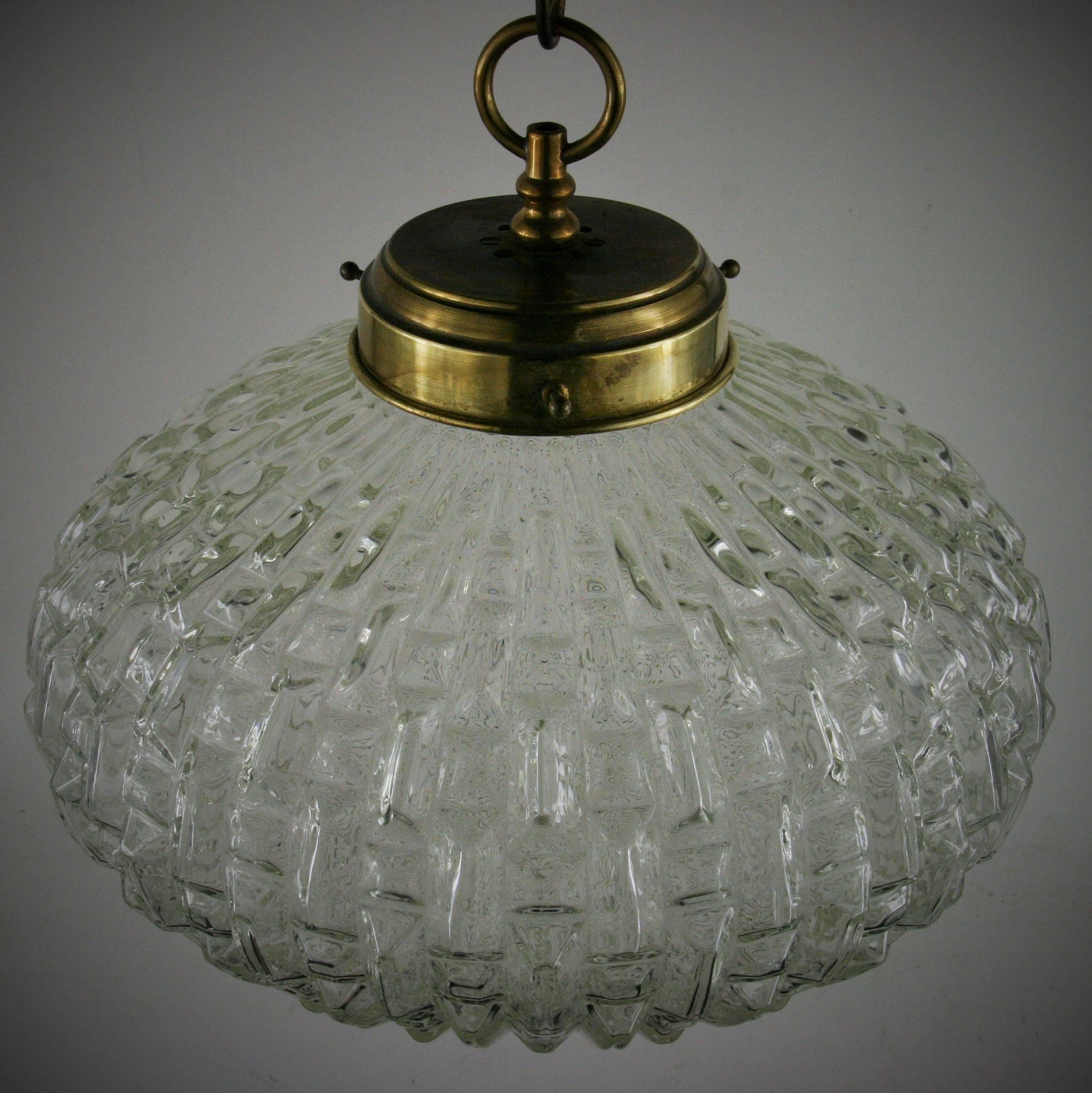 1-2983ab, ovoid shaped geometric pendant.
2 available in clear glass with brass or nickel hardware.
Needs wiring

  