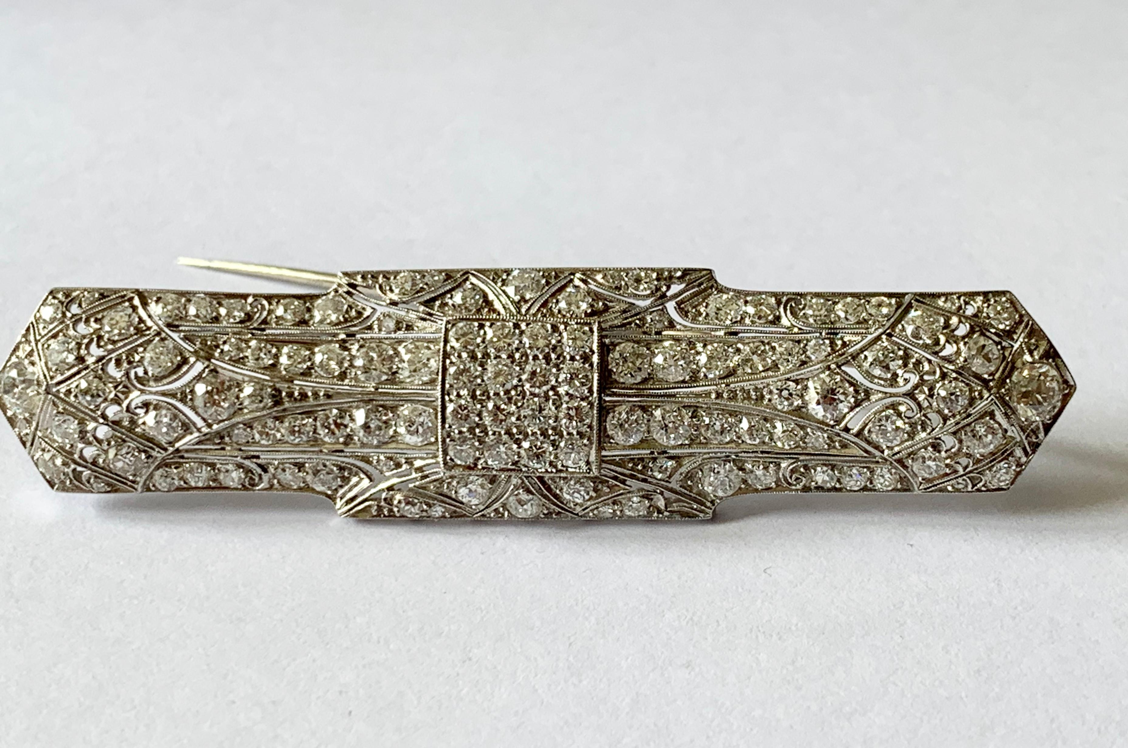 A lovely, elegant and very wearable Art Deco bar pin brooch in very geometric design typical for this period. The brooch is featuring 80 european cut diamonds with an approximate total weight of 5 ct, H color, vs. 
Brooch length: 7.40 cm
Brooch