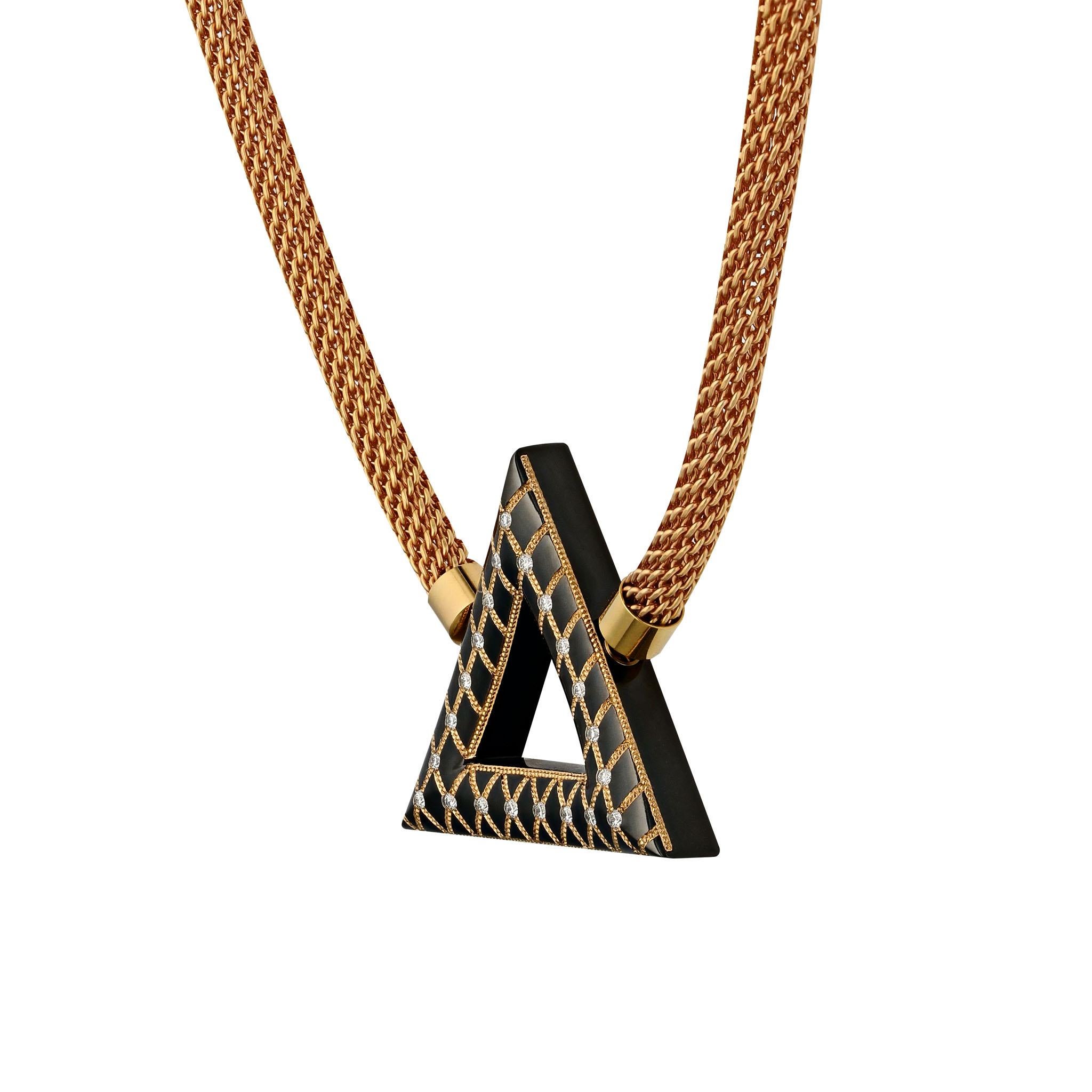 Eye catching triangular pendant in Knightsteel. This 37 mm triangular pendant has an undulating surface which is inlaid with 22K Rose Gold. This inlay has been shaped in the technique created and patented by Zoltan David (US Patent #6594901). There