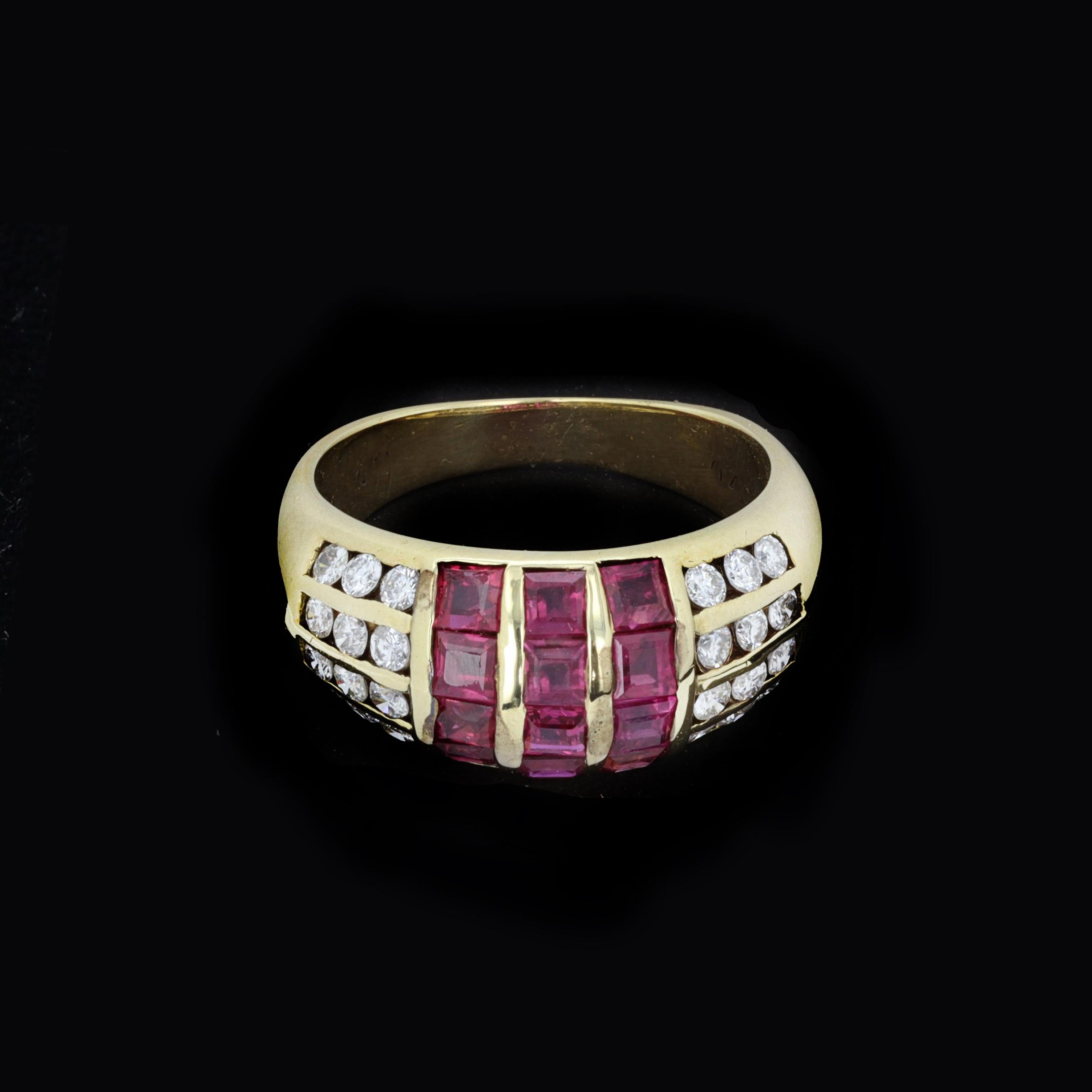 Columns of deep red rubies are framed by rows of bright diamonds in the striking geometric design of this estate ring. Set in polished 14 K yellow gold. 

The approximately 12 square-cut rubies weigh approximately 1.00 carat in total. The 24 round