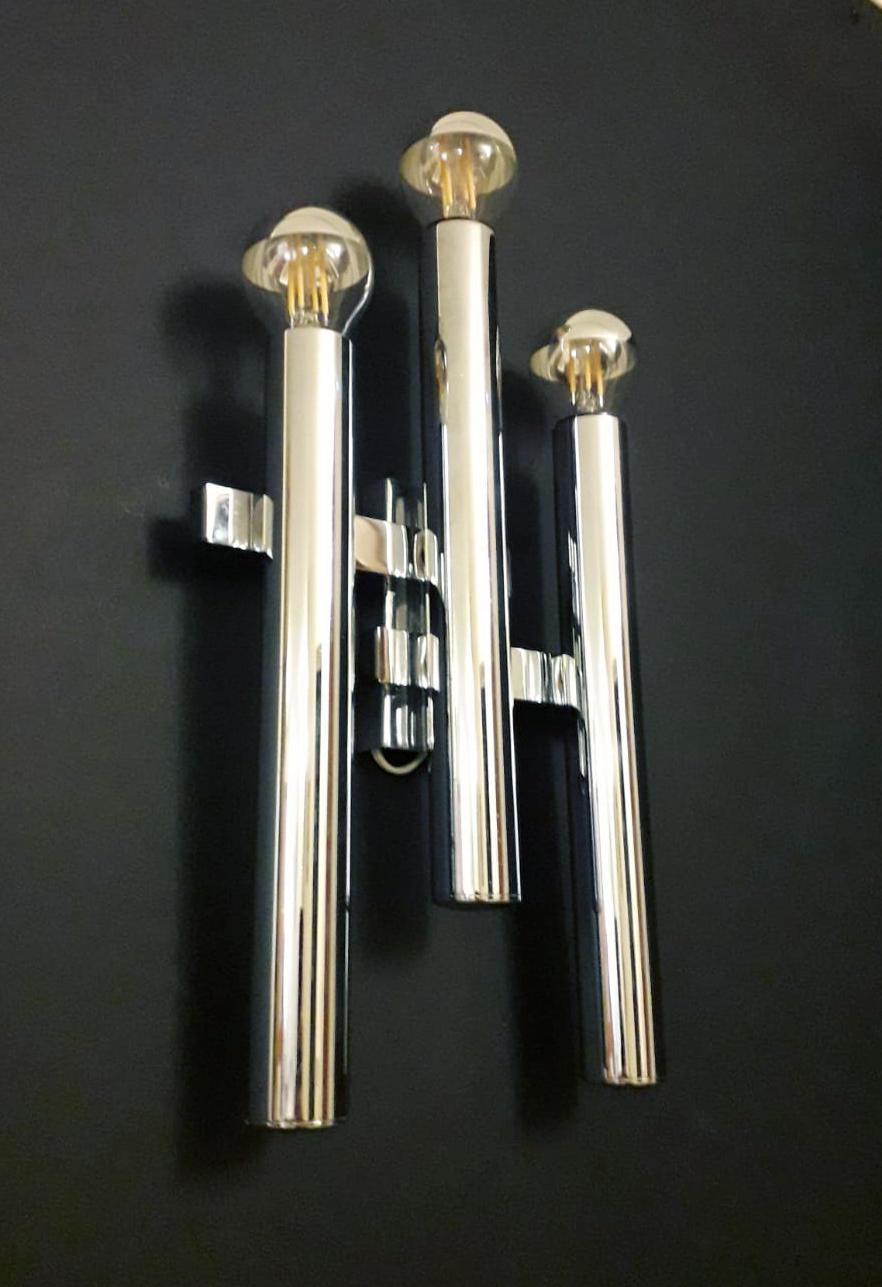Vintage midcentury Italian chrome wall lights with three tubes arranged at different heights, designed by Gaetano Sciolari / Made in Italy circa 1970s
3 lights / E12 or E14 type / max 40W each
Measures: Height 12 inches, width 8 inches, depth 2.5