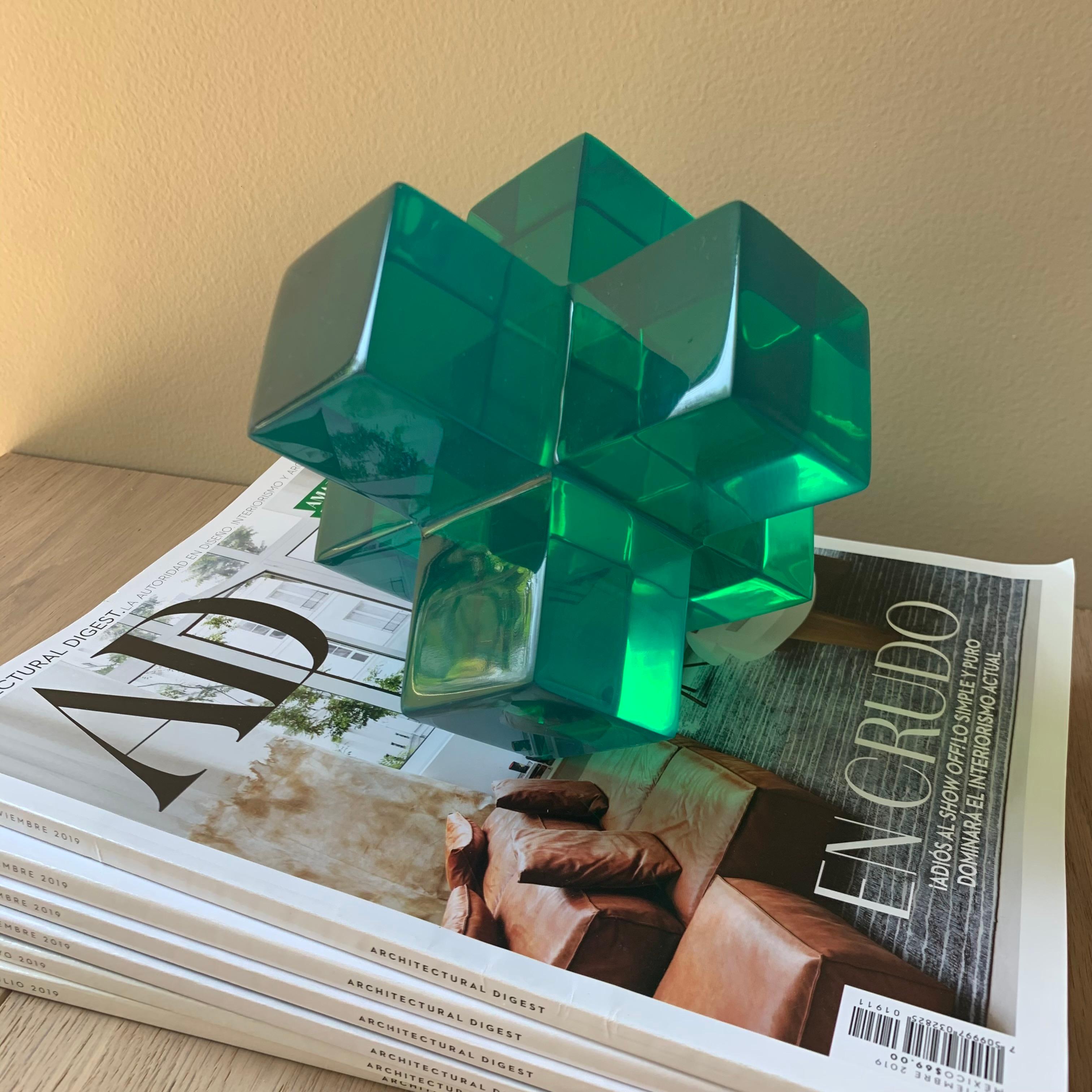 Geometric sculpture made in polished resin in variety of colors. 
It is a modern and colorful piece that will liven up any space.
This sculpture is very versatile and fun! You can create a different sculpture just by stacking up to three pieces.We