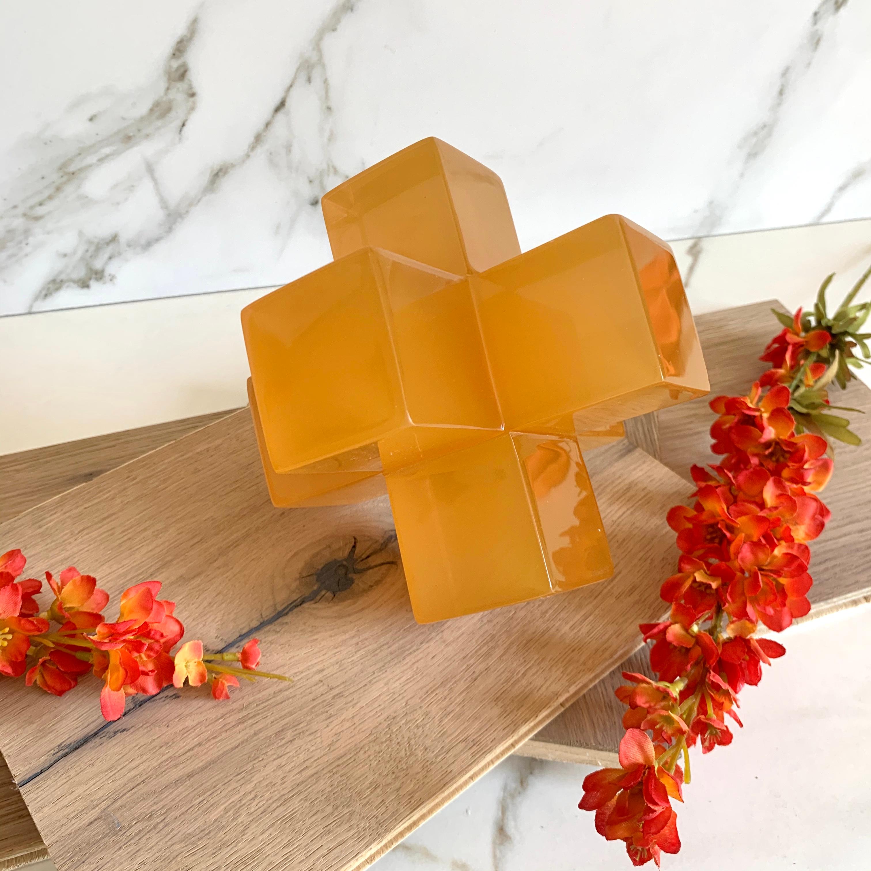 Geometric sculpture made in polished resin in variety of colors. It is a modern and colorful piece that will liven up any space.

This sculpture is very versatile and fun! You can create a different sculpture just by stacking up to three pieces.We