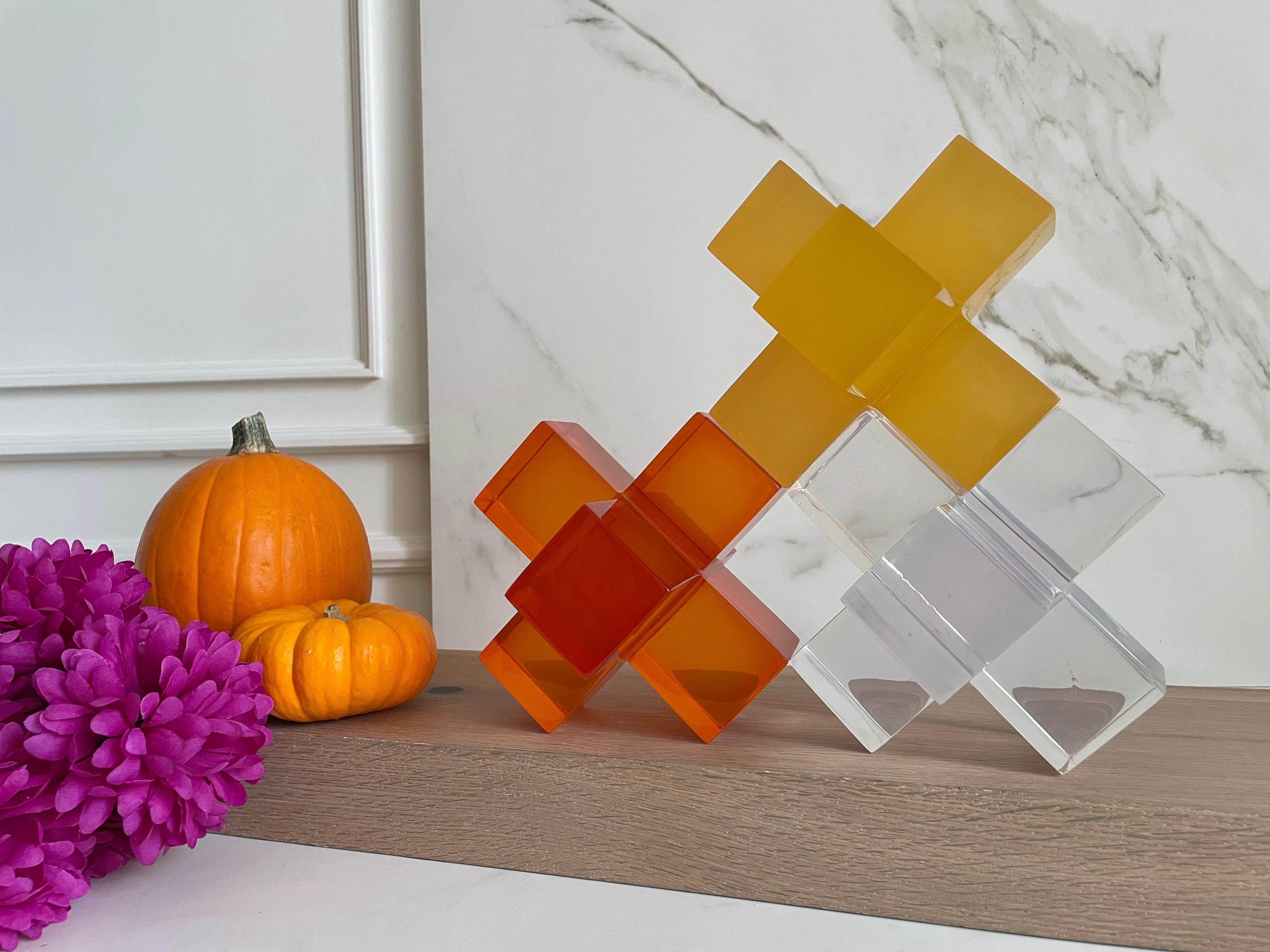Geometric sculpture made in polished resin in variety of colors. It is a modern and colorful piece that will liven up any space.

This sculpture is very versatile and fun! You can create a different sculpture just by stacking up to three pieces.We