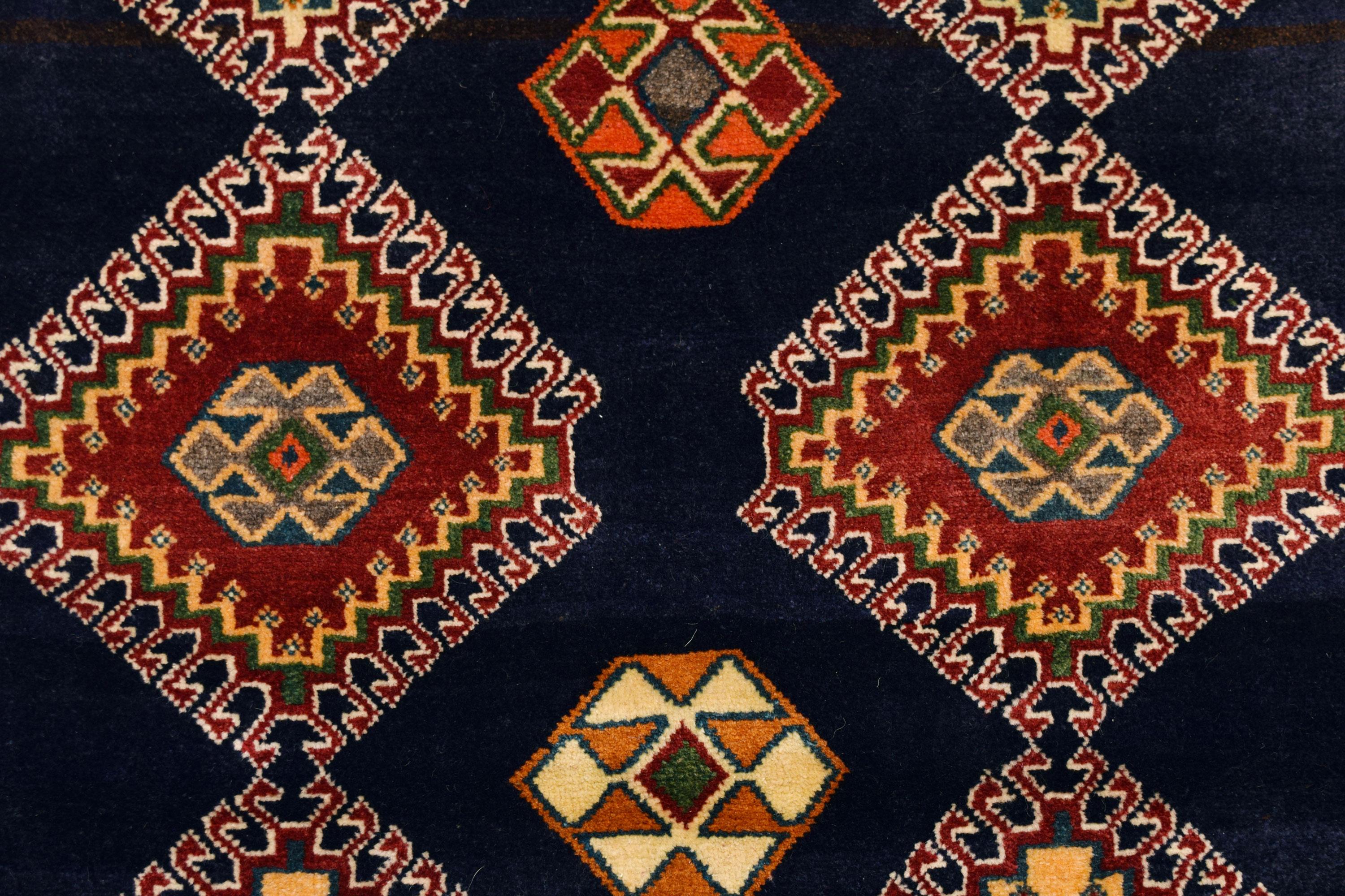 Imitating the enchantment and allure of a Persian flower garden, this Persian Qashqai carpet is hand-knotted and measures 3’10” x 6’1”. Because this carpet utilizes a traditional Persian weaving technique, the pile is soft and plush while the