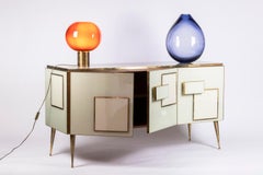 Geometric sideboard in glass and gilded brass. Contemporary Italian work.