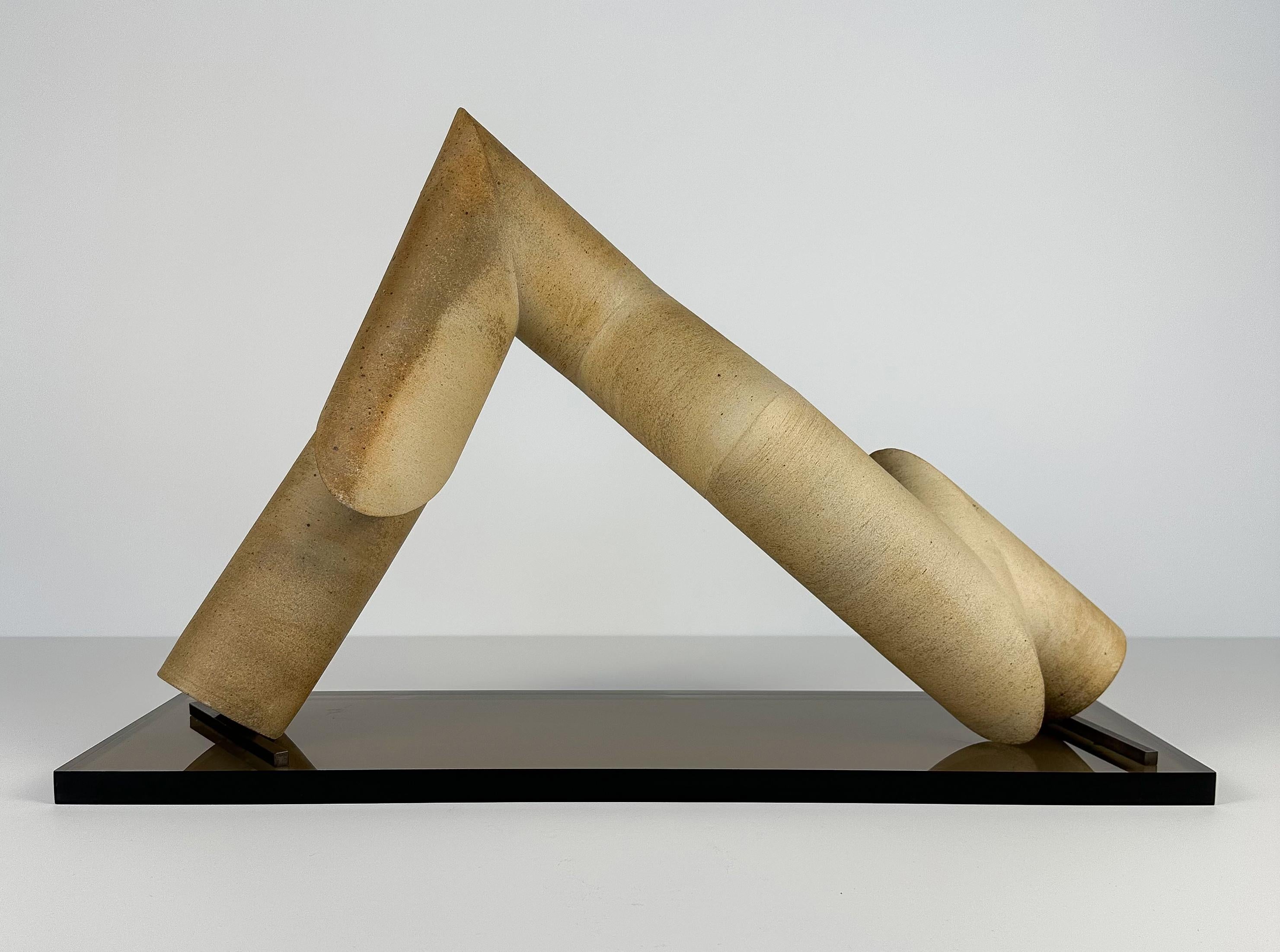 An incredible geometric / abstract pottery sculpture by Gordon Orear (b.1923), circa 1980s. Hand-built three-dimensional unglazed stoneware sculpture on original smoked lucite rectangular base with bronze supports. The sculpture is formed from eight