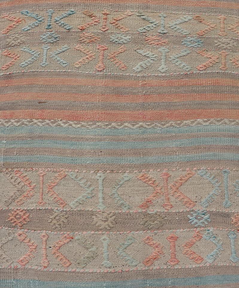 Turkish Kilim vintage carpet in blue-grey, soft coral, and cream. Keivan Woven Arts / rug EN-179854, country of origin / type: Turkey / Kilim, circa 1950

Featuring a striking stripe design, this unique mid-century Kilim runner showcases beautiful