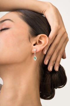 Geometric Style Oval Emerald and Diamond Halo Drop Earrings in 14K Yellow Gold