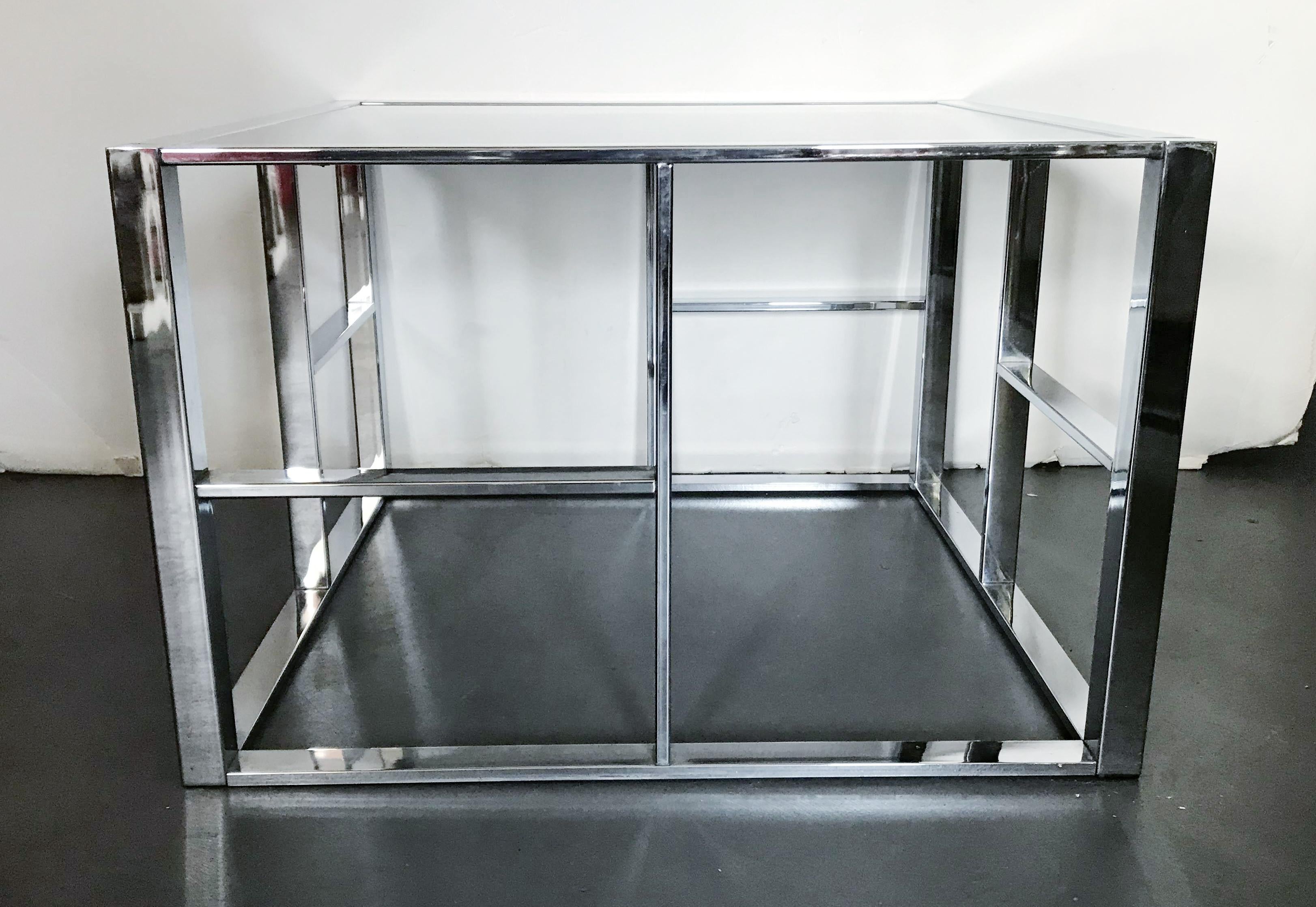 Vintage midcentury coffee or side table in Art Deco style, with geometric chrome frame and smoky glass top / Made in the USA circa 1970s
Measures: length 31 inches, width 31 inches, height 20 inches
1 available in stock in Palm Springs ON FINAL