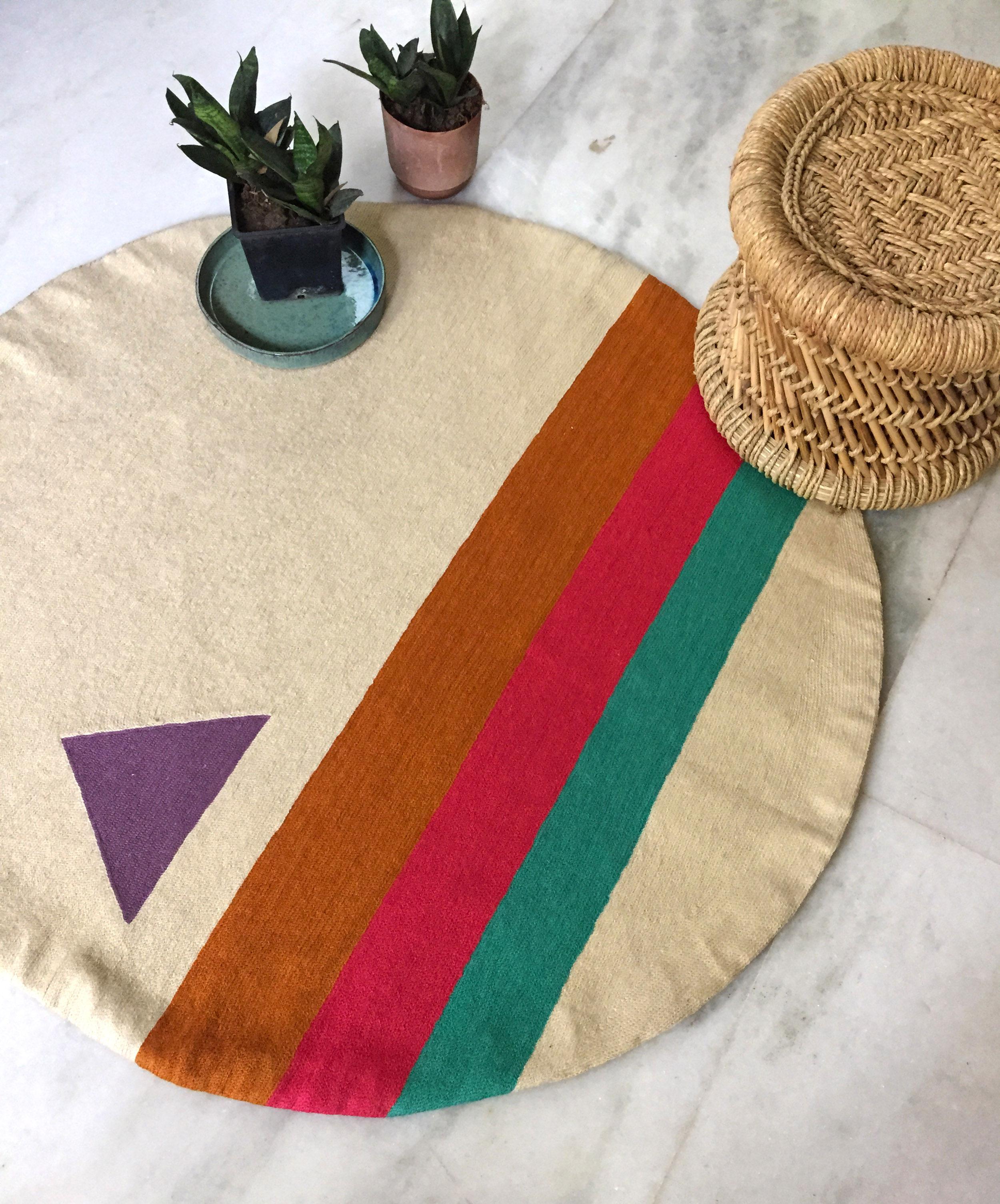 This modern round rug has been ethically hand embroidered by artisans in Kashmir, India, using a traditional embroidery technique which is native to this region.

The purchase of this handcrafted rug helps to support the artisans and preserve their