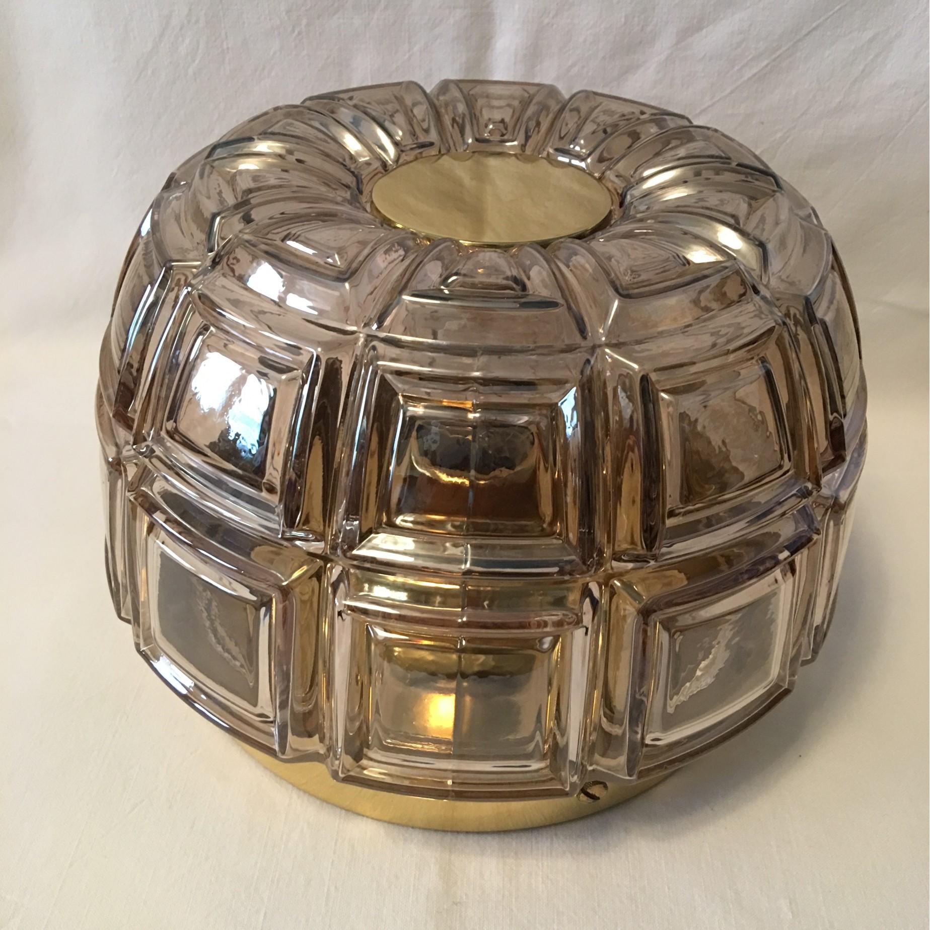 A great lighting effect created by this Geometric Textured glass flush mount or wall lamp from Glasshuette Limburg . It requires a European E 26 / 27 Edison Bulb up to 75 Watts. Rewired to meet U.S. standards. Lovely item.