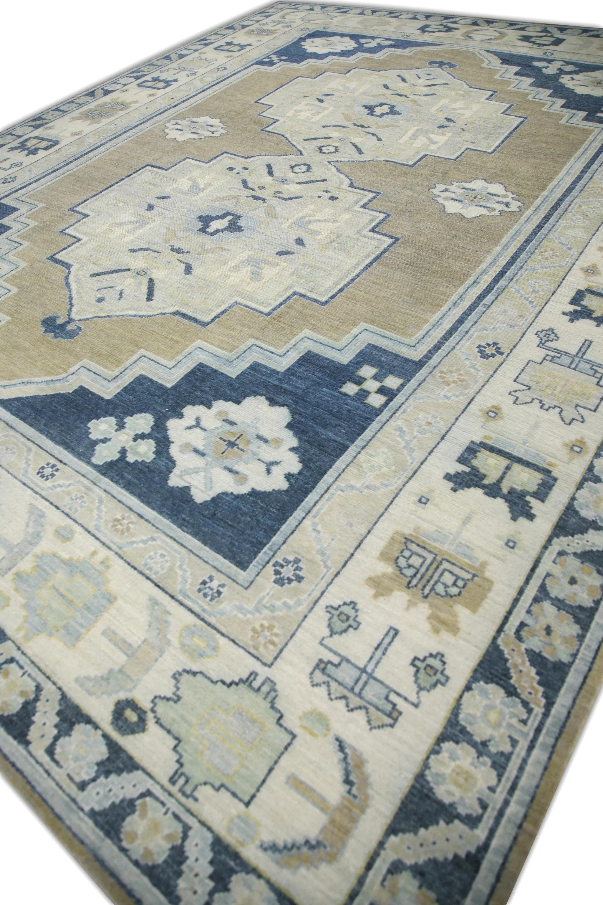 This modern oversized fine-woven Turkish Oushak rug is a stunning piece of art that has been handwoven using traditional techniques by skilled artisans. The rug features intricate patterns and a soft color palette that is achieved through the use of