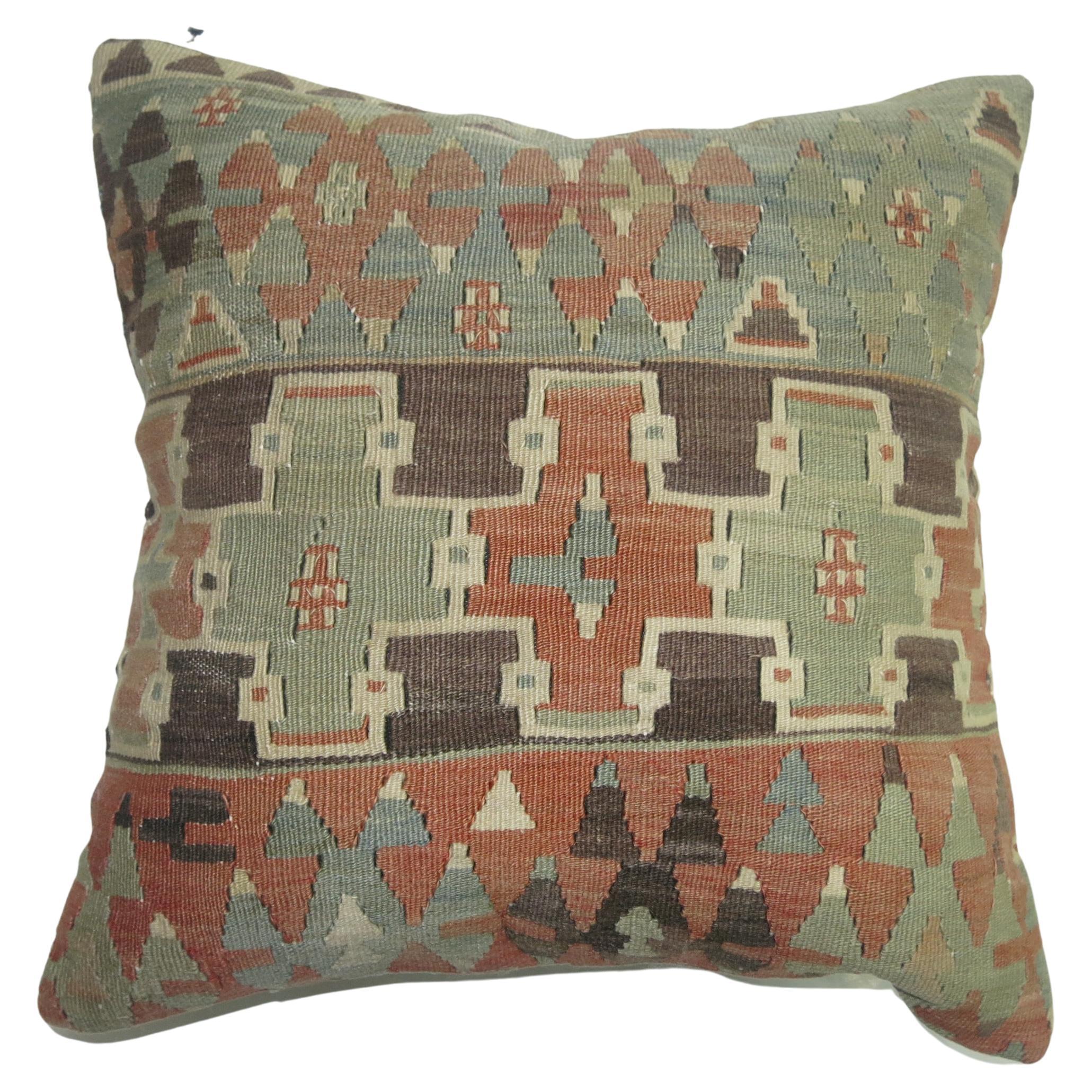 Pillow made from an early 20th century Turkish Kilim. Polyfill insert provided with a zipper closure.

Measures: 18'' x 18''.